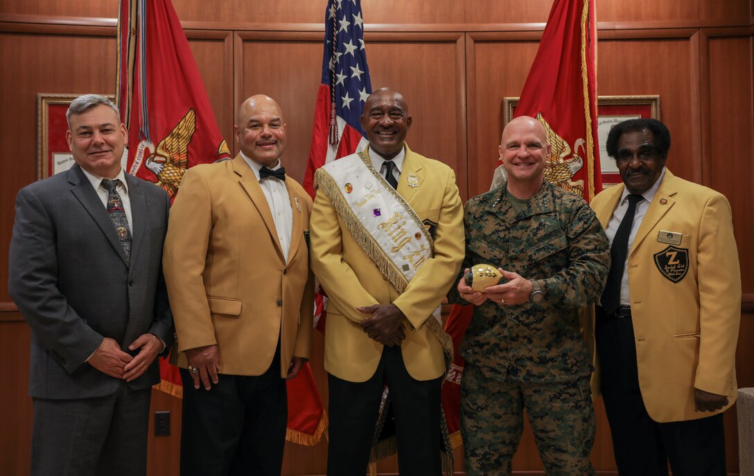Members of the Zulu Social Aid and Pleasure Club met with Lt. Gen David G. Bellon, commander of Marine Forces Reserve, right, and Mr. Gregg T. Habel, executive director, left, at Marine Corps Support Facility New Orleans, Dec. 17, 2021. The Zulu Social Aid and Pleasure Club has supported the Toys for Tots Program since 2006, which is run by the Marine Corps Reserve. (U.S. Marine Corps photo by Lance Cpl. Leslie Alcaraz)