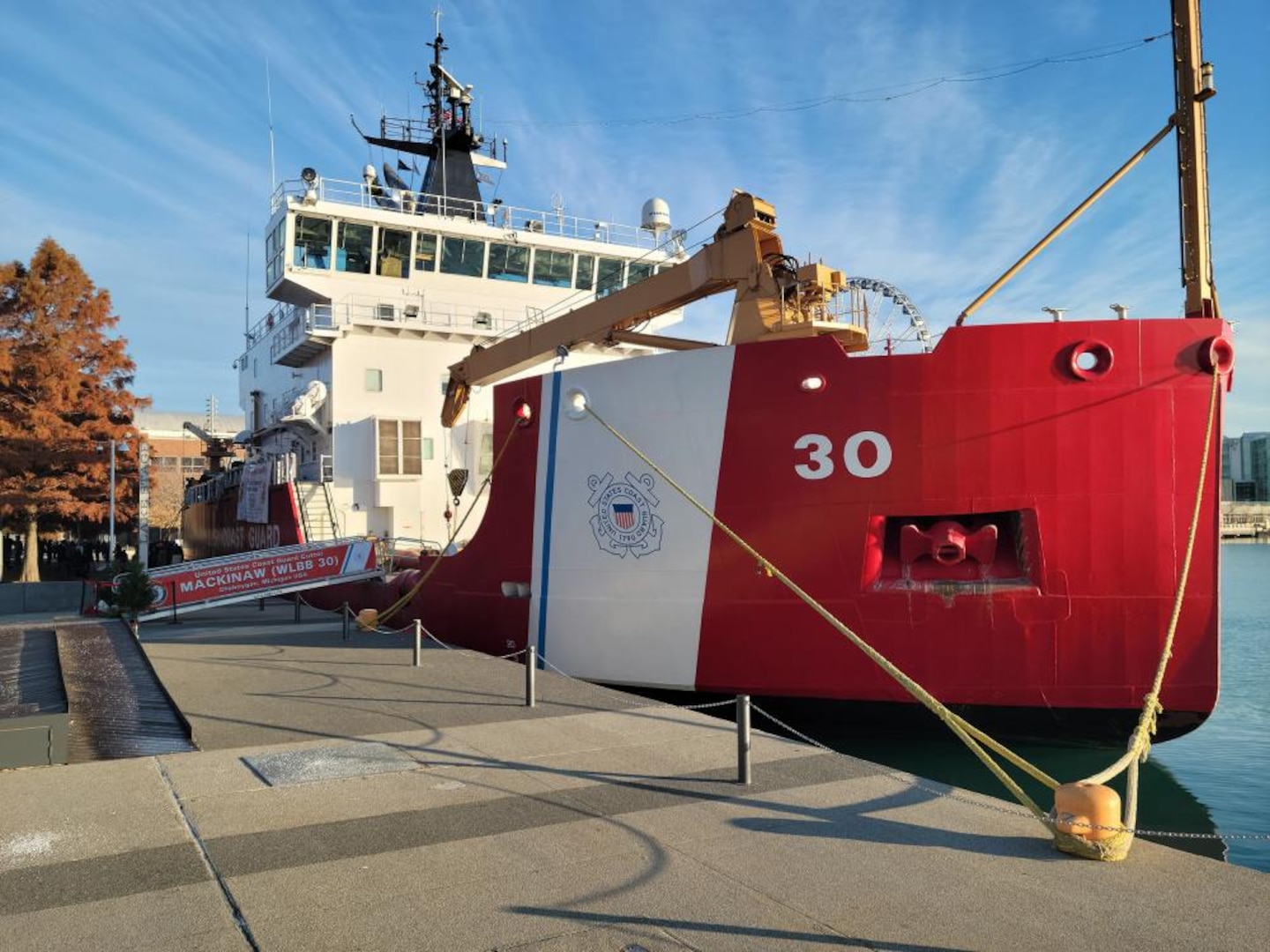 Coast Guard Cutter Mackinaw moors at Chicago's Navy Pier Dec. 4, 2021, in preparation for unloading a cargo of 1,200 Christmas trees bound for Chicago families that otherwise wouldn't have one. The ship was participating in the 22nd annual Chicago's Christmas Ship celebration. U.S. Coast Guard photo by Bradley Couch, U.S. Coast Guard Auxiliary.