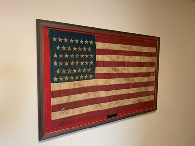 Framed flag with 46 stars.