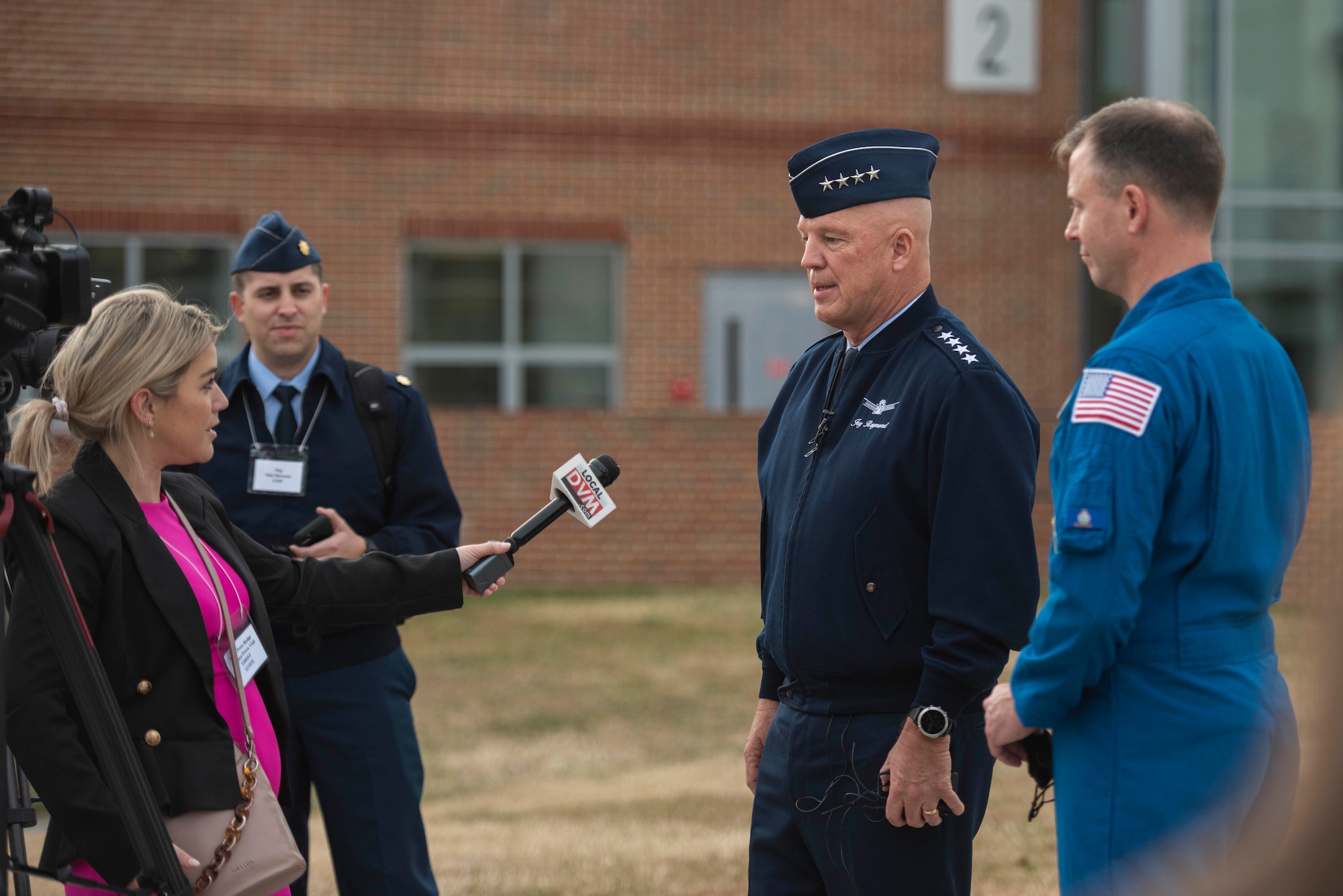 Chief of Space Operations Gen. John W. “Jay” Raymond and NASA astronaut Col. Nick Hague answer questions from media after a "STEM to Space" visit at Thomas Jefferson High School in Alexandria, Va., Dec. 15, 2021. STEM to Space started as a small team project to celebrate the first Space Force birthday with the initial intent to get out into the local D.C. area to meet with classrooms and talk about the service and STEM, and grew to reach more than 66,000 students in all 50 states, Washington D.C., Puerto Rico, Guam, South Korea, Japan, Belgium, Germany, the United Kingdom, and Italy in its second year. (U.S. Air Force photo by Staff Sgt. Jeremy L. Mosier)