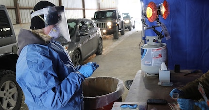 Wisconsin National Guard Citizen-Soldiers and -Airmen collect specimens for COVID-19 testing in 2021. The Wisconsin National Guard has multiple COVID-19 specimen collection teams operating throughout the state and has administered nearly 1.2 million COVID tests and more than 230,000 vaccines statewide since the pandemic began.