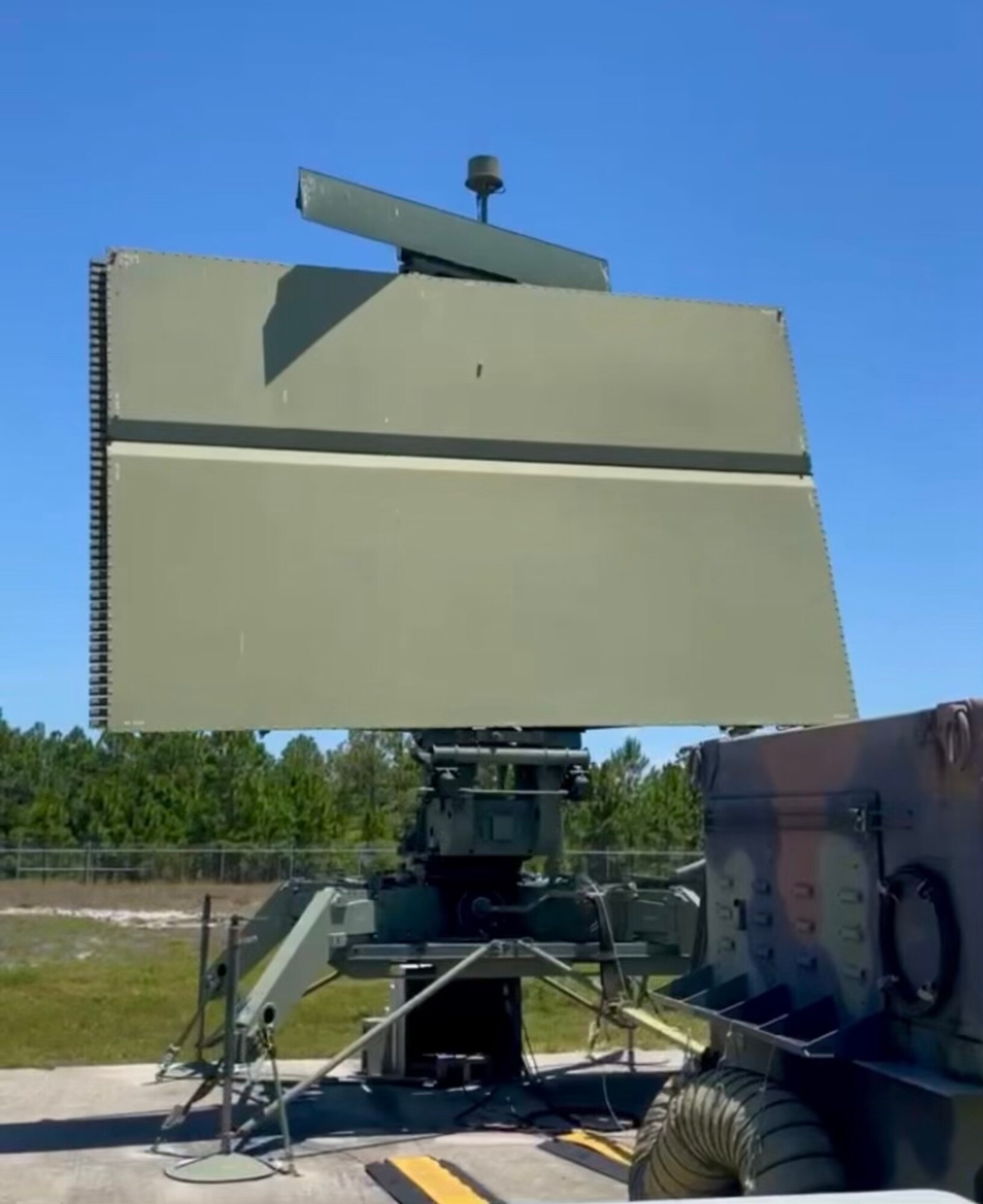 An AN/TPS-75 long range air surveillance radar assigned to the 81st Air Control Squadron, Tyndall Air Force Base, Florida is deployed to a site in the Florida Gulf Coast to provide air domain awareness for Checkered Flag 22-1. Checkered Flag is a large-force aerial exercise held at Tyndall which fosters readiness and interoperability through the incorporation of fourth- and fifth-generation aircraft during air-to-air combat training. (Courtesy photo)