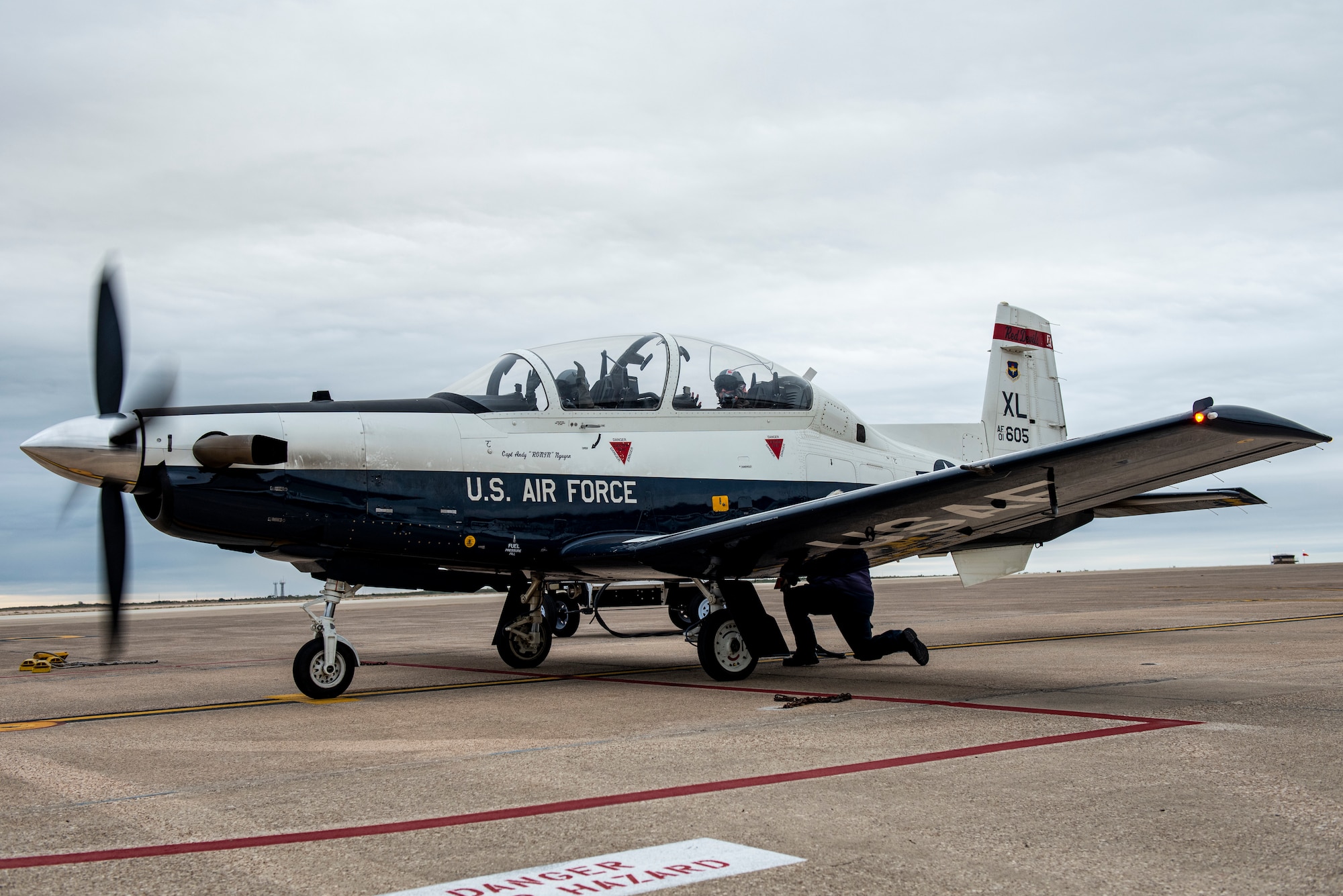 2nd Lt. Rosaria, 47th Flying Training Wing international student pilot, Capt. Curtis Billig, 434th Flying Training Squadron flight commander, waits for the signal to taxi off and go for takeoff.  The Texan II T-6 is the first aircraft that all pilots fly at the beginning of their pilot training journey here at Laughlin Air Force Base. (These photos have been edited to hide the last name of the student)  (U.S. Air Force photo by Senior Airman David Phaff)