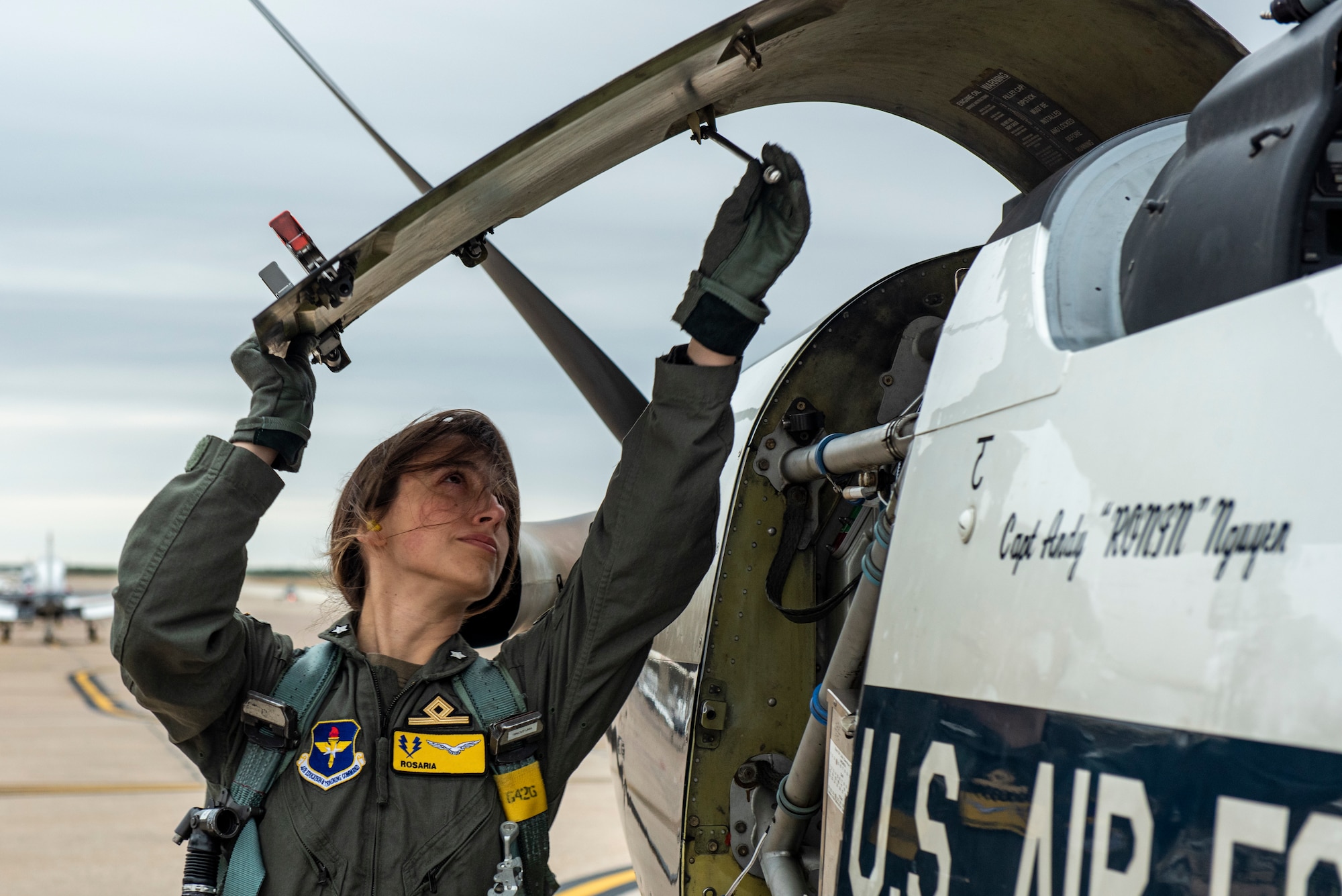 2nd Lt. Rosaria, 47th Flying Training Wing international student pilot, performs her pre-flight checks of a Texan II T-6 aircraft before take-off.  Laughlin Air Force Base assists in training pilots from allied countries from all around the globe. (These photos have been edited to hide the last name of the student) (U.S. Air Force photo by Senior Airman David Phaff)