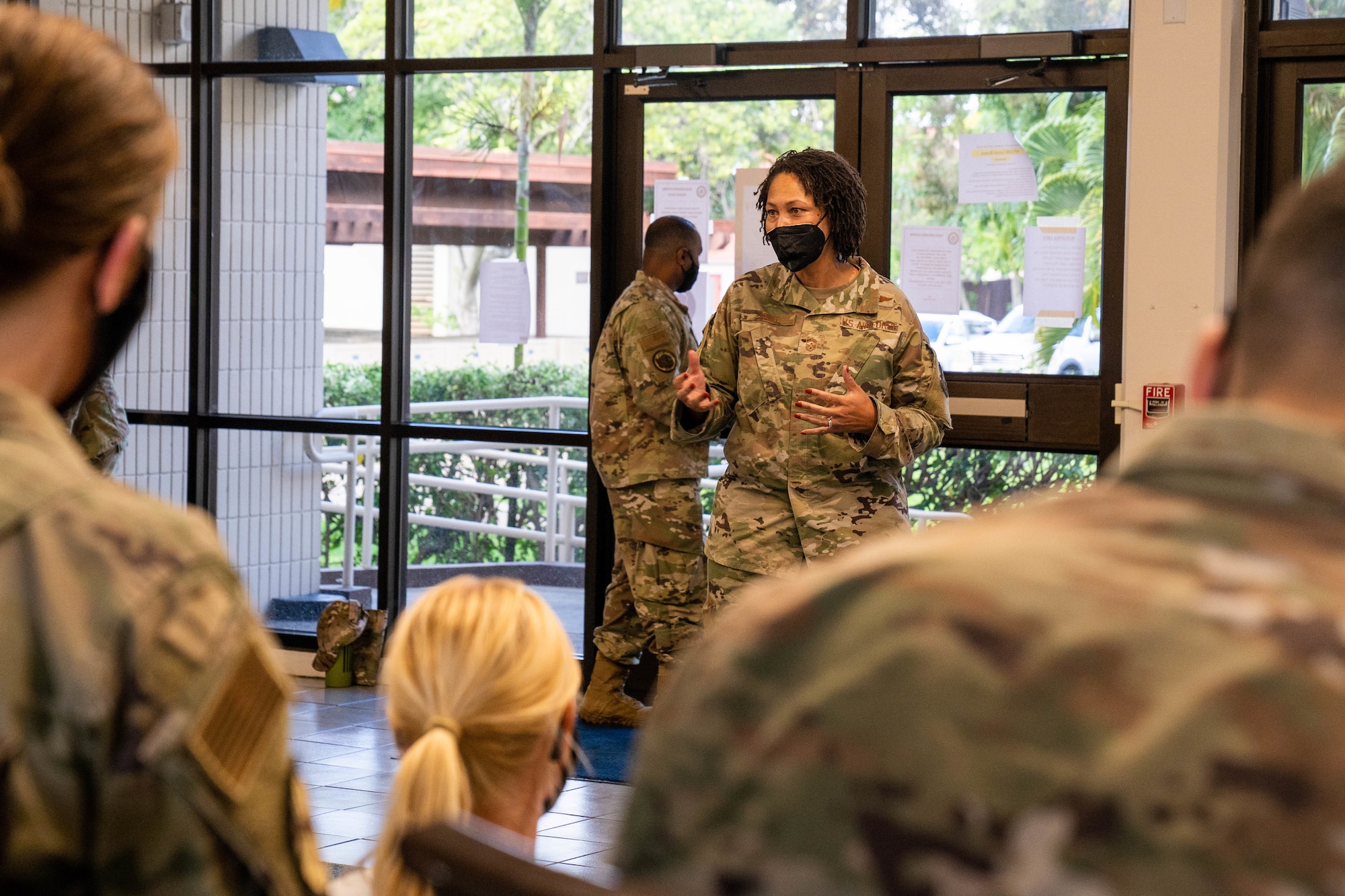 Chief Master Sgt. Sheronne King, 15th Wing command chief, engages with unaccompanied housing Airmen during a dormitory town hall addressing the water situation at Joint Base Pearl Harbor-Hickam, Hawaii Dec. 16, 2021. Air Force leadership met with Airmen and had an open discussion addressing their concerns and questions regarding the water quality recovery efforts on base. (U.S. Air Force photo by Airman 1st Class Makensie Cooper)
