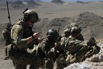 Airmen from the 13th Air Support Operations Squadron, 3rd Air Support Operations Group, Advanced Instructors Course,  call indirect fire from close air support as part of the U.S. Air Force Weapons School during a joint training mission with Soldiers of C Battery, 2nd Battalion, 12th Field Artillery Regiment, 1st Stryker Brigade Combat Team, 4th Infantry Division, near Nellis Air Force Base, Nevada. (Photo by Sgt. Meghan Berry)