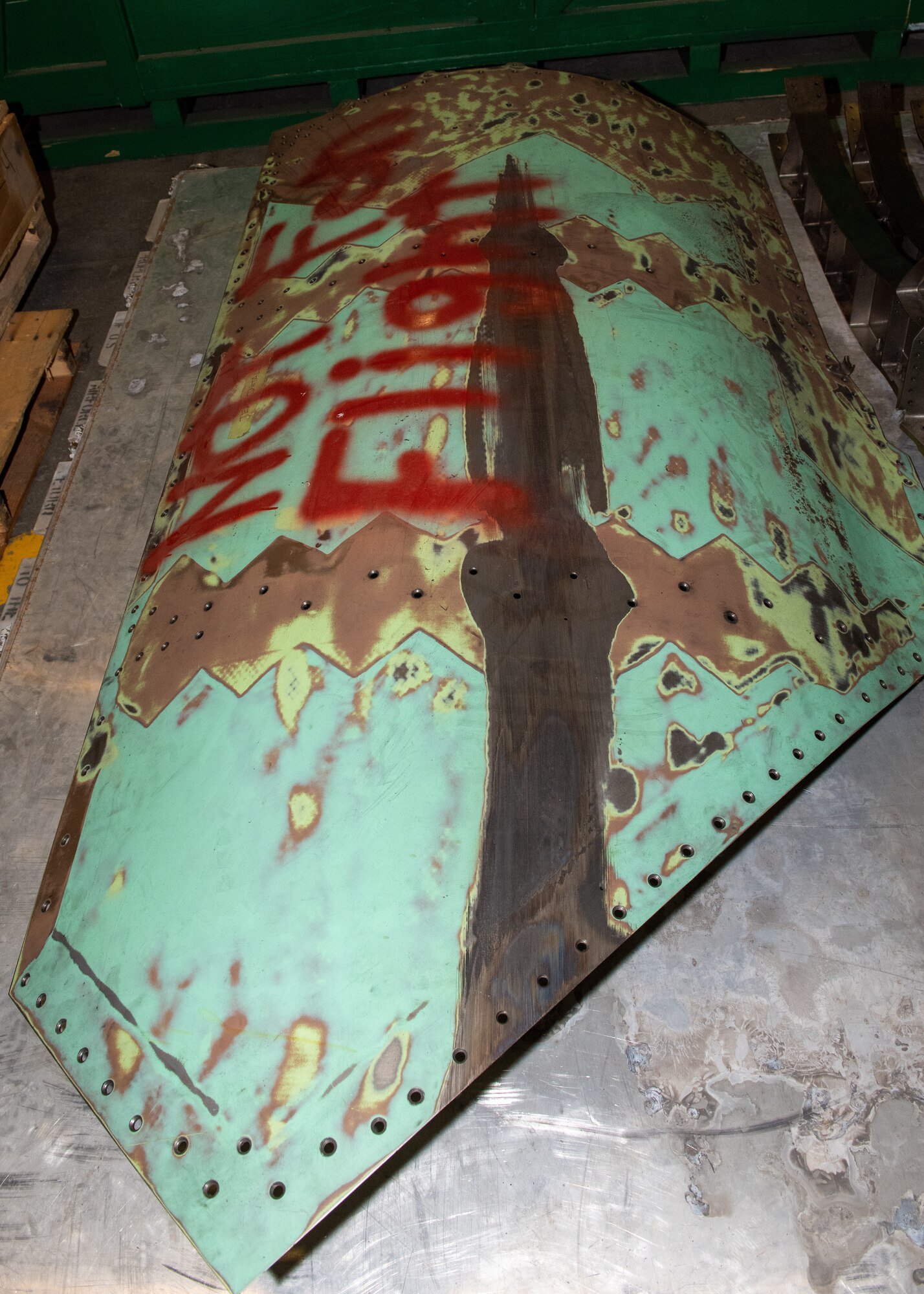 Damaged F-22 aircraft part.
