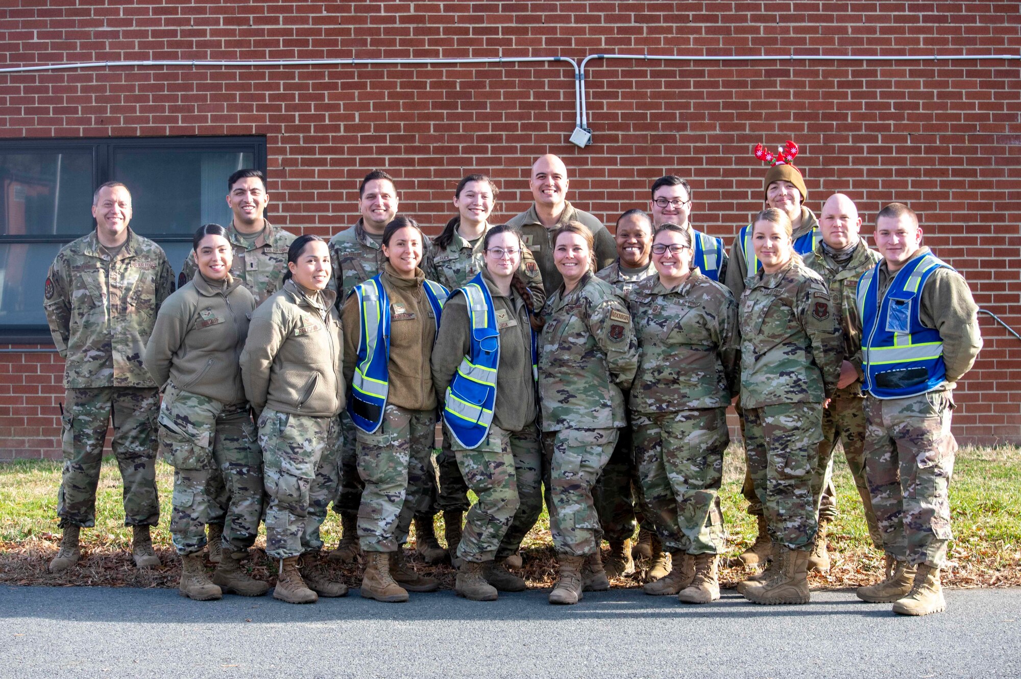 Chief Master Sgt. Dawn Teachworth, Village 1 senior enlisted leader poses for a photo with her team in Liberty Village on Joint Base McGuire-Dix-Lakehurst, New Jersey, December 16, 2021.