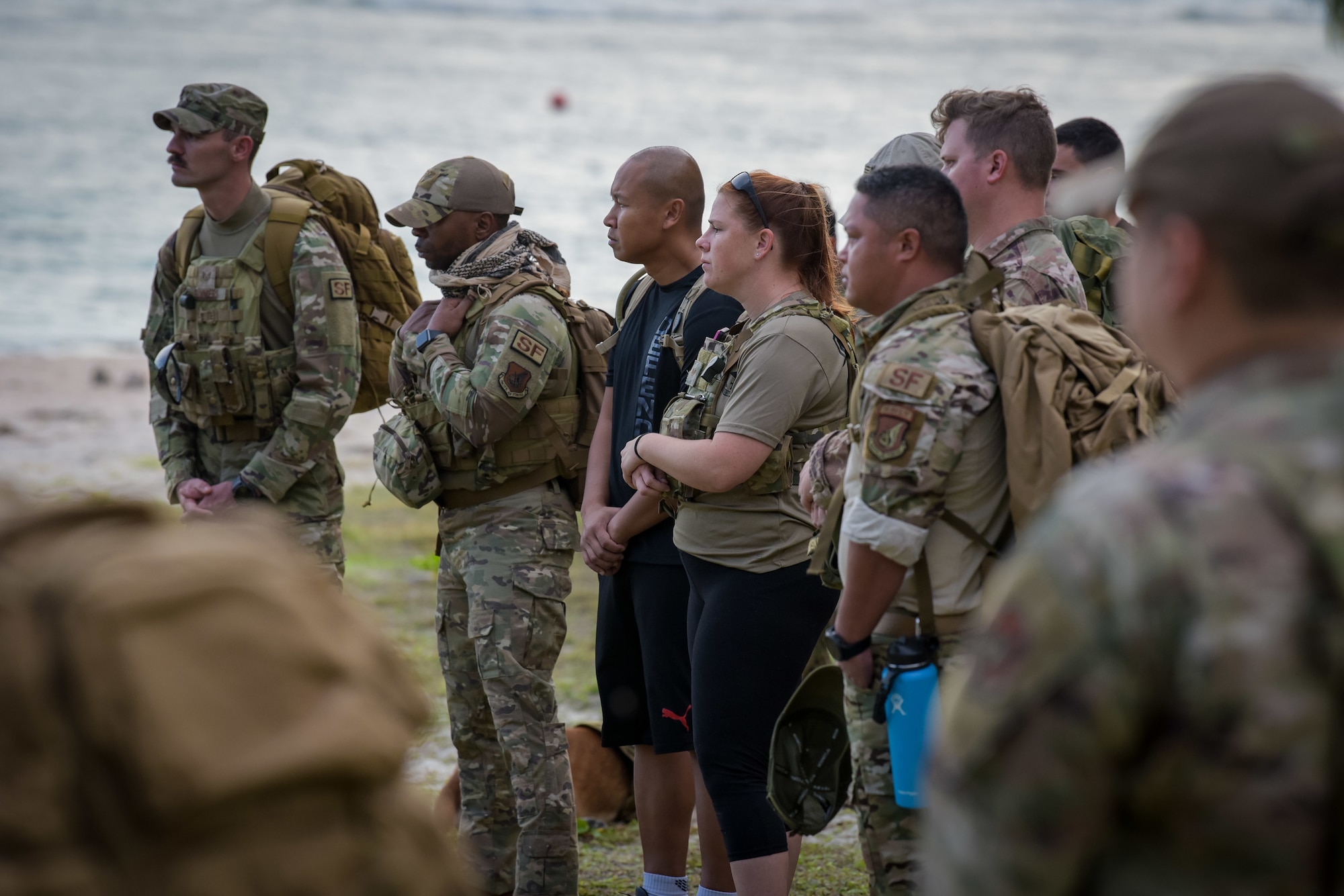 Members of Team Andersen attend a Memorial ceremony during the annual Office of Special Investigations Memorial Ruck at Andersen Air Force Base, Guam, Dec. 21, 2021.