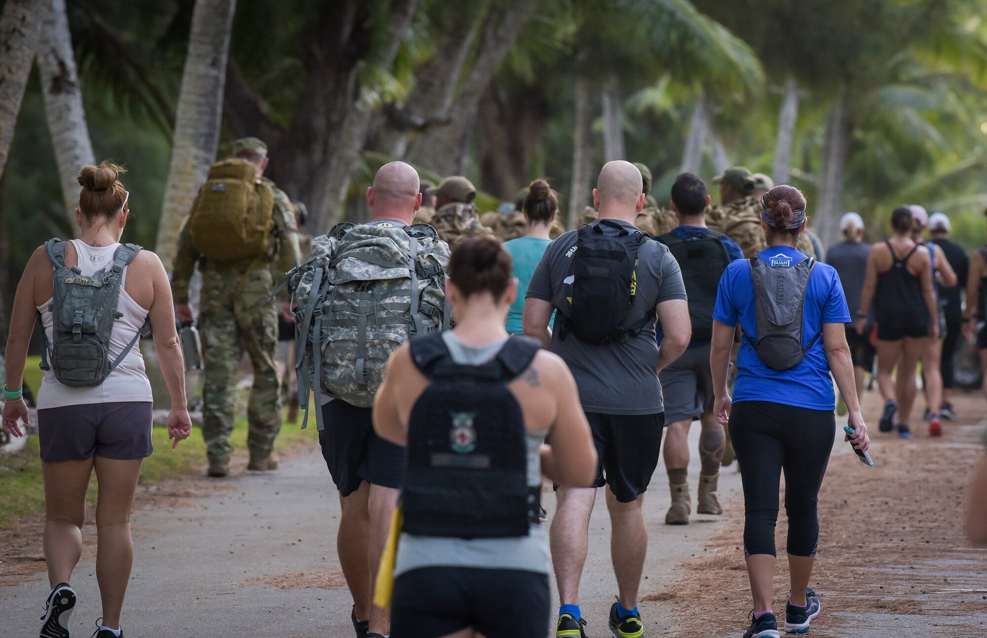 Members of Team Andersen ruck/walk during the annual Office of Special Investigations Memorial Ruck at Andersen Air Force Base, Guam, Dec. 21, 2021.