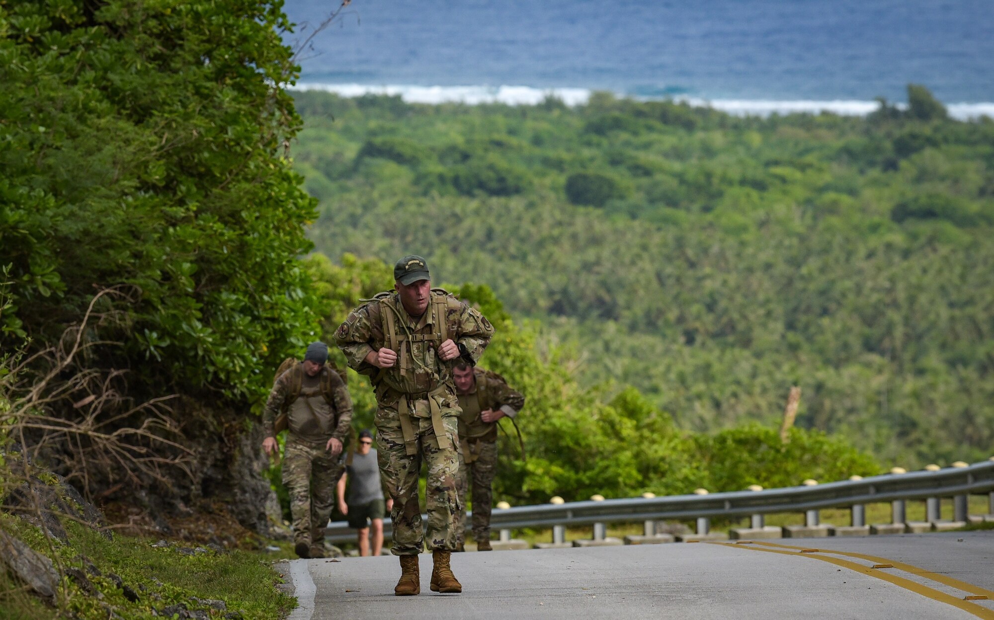 Members of Team Andersen ruck/walk during the annual Office of Special Investigations Memorial Ruck at Andersen Air Force Base, Guam, Dec. 21, 2021.