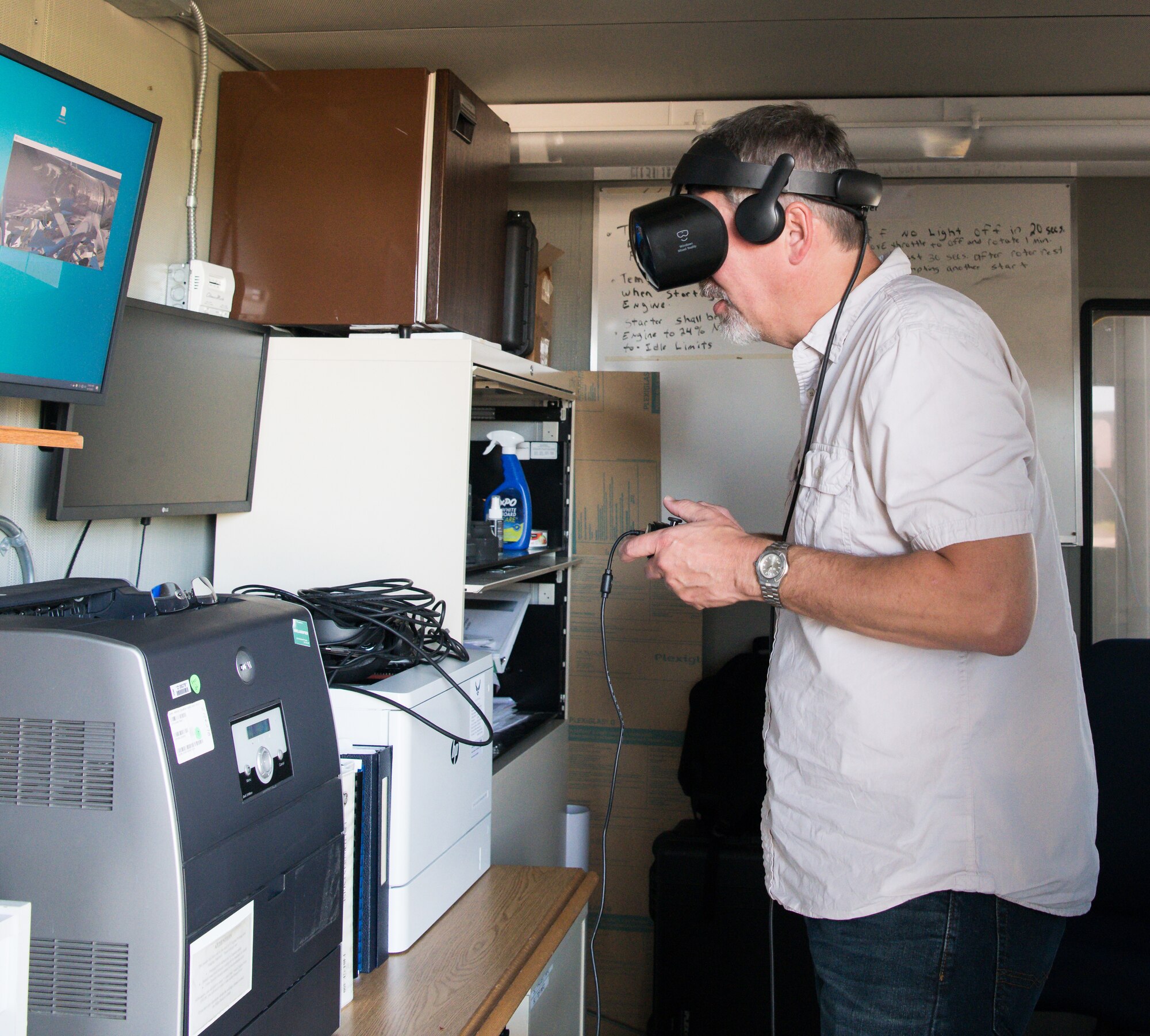Lafe Redd, co-founder and CEO of Augmntr, wears a headset to view the Sea Level Test Cell using the virtual reality (VR) capability of the Virtual Test Cell Presence System (VTCPS), as preparations are made for a run of a General Electric F404 engine for sensor testing June 15, 2021, at Arnold Air Force Base, Tenn.