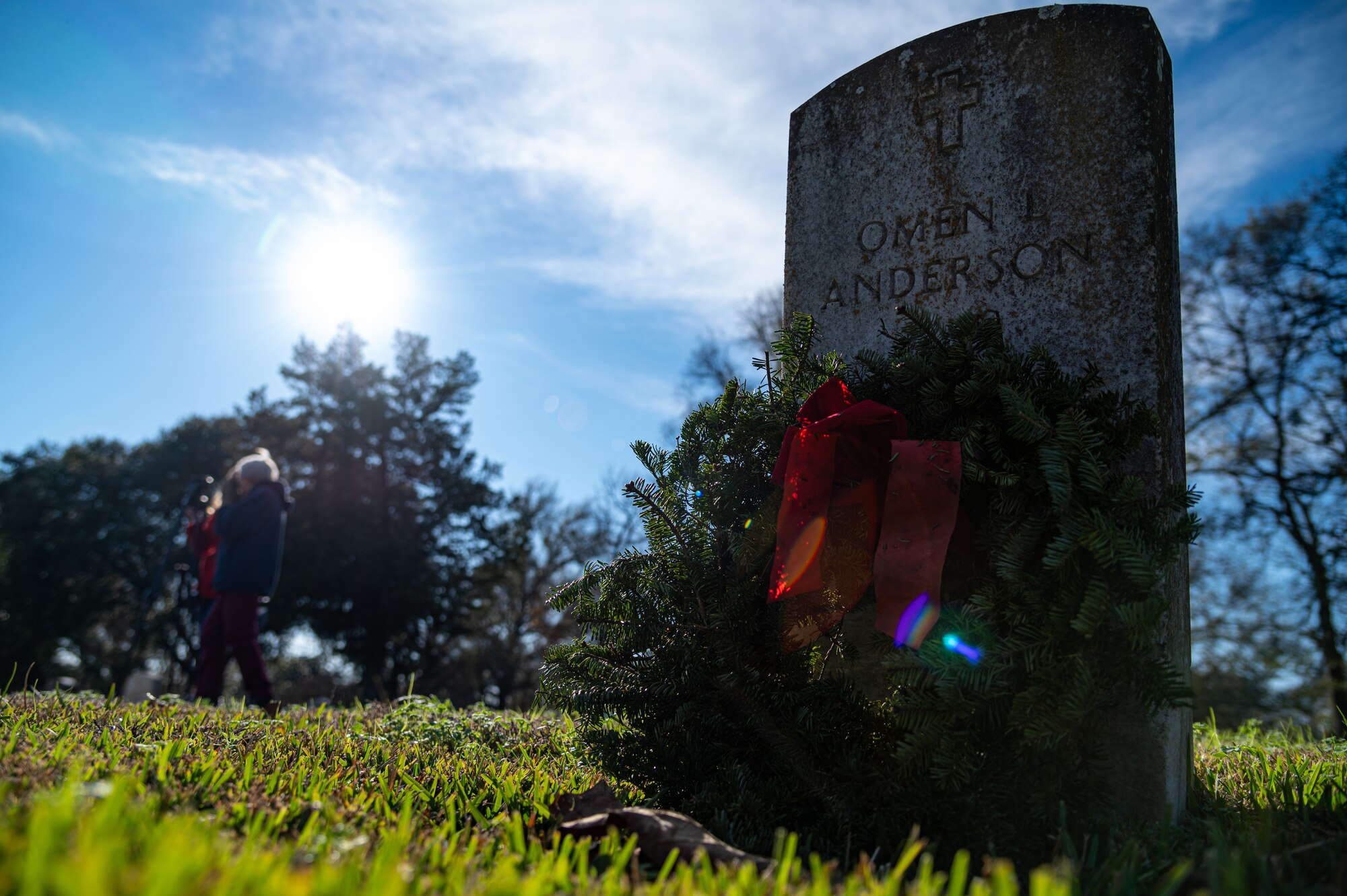 A wreath is laid upon the grave of a fallen veteran during a National Wreaths Across America ceremony at Bossier City, Louisiana, Dec. 19, 2021.