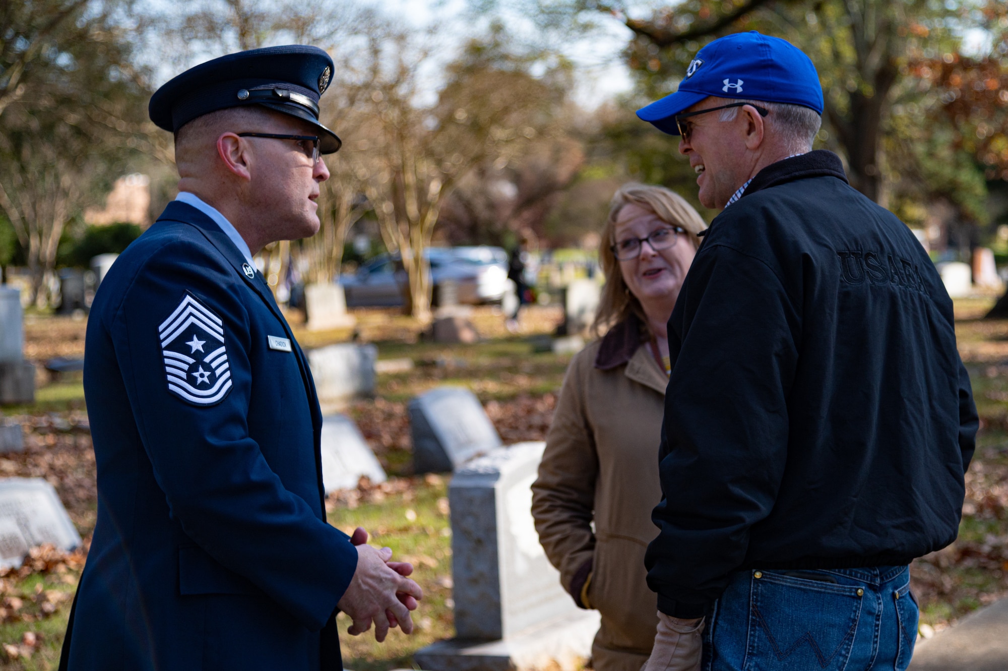 Chief Master Sgt. Travis Chadick, 2nd Bomb Wing command chief, speaks with local community members following a National Wreaths Across America ceremony at Bossier City, Louisiana, Dec. 19, 2021.