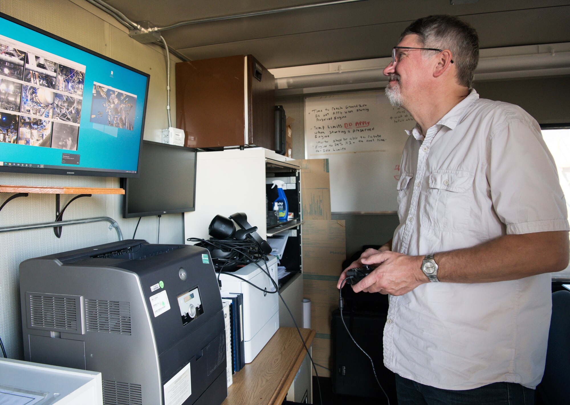 Lafe Redd, co-founder and CEO of Augmntr, navigates the interface of the Virtual Test Cell Presence System, as preparations are made for a run of a General Electric F404 engine installed in Sea Level Test Cell 1 for sensor testing June 15, 2021, at Arnold Air Force Base, Tenn.