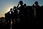 Airmen stand in formation.