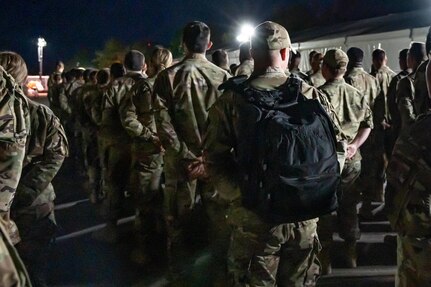 Airmen stand in formation.