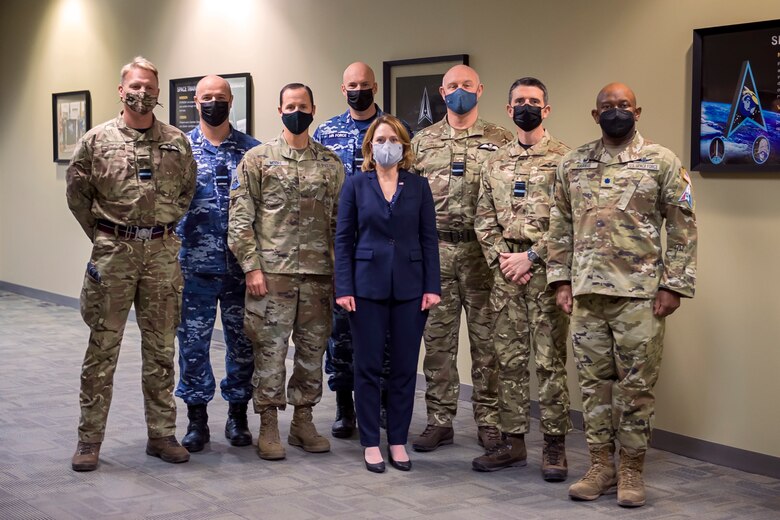 SPACE FLAG 22-1 senior leaders and distinguished visitors stand for a group photo with Dr. Kathleen Hicks, the Deputy Secretary of Defense at Schriever Space Force Base, Colorado, Dec. 13, 2021. From left to right: Air Cdre JJ “Jez” Attridge, UK, Air Cdre Nicholas Hogan, Director General Space Domain Review, AUS, Brig Gen Todd Moore, Deputy Commander, STARCOM, John Haly, Air and Space Attache  AUS, Dr. Kathleen Hicks, the Deputy Secretary of Defense, Air Vice-Marshall Harvey “Harv” Smyth, Director Space UK, Air Vice-Marshall Paul Godfrey, Commander UK Space Command, Lt Col Albert Harris III, 392 Combat Training Squadron Commander.  (U.S. Space Force photo by Judi Tomich)