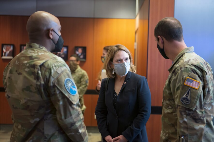 U.S. Space Force Brig Gen Todd Moore (Right), Space Training and Readiness Command Deputy Commander, and U.S. Space Force Lt Col Albert Harris (Left), 392d Combat Training Squadron Commander greet Dr. Kathleen Hicks, the Deputy Secretary of Defense before her tour of SPACE FLAG 22-1 at Schriever Space Force Base, Colorado, Dec. 13, 2021.  SPACE FLAG is a Department of the Air Force Sponsored, Chief of Space Operations Directed exercise that readies space warfighters to defend the United States’ and Coalition Partners’ interests in space. (U.S. Space Force photo by Judi Tomich)