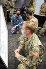 Participants of SPACE FLAG 22-1 conduct mission planning in preparation for simulated combat operations, Dec. 9, 2021 at Schriever Space Force Base, Colorado.  SPACE FLAG is a Secretary of the Air Force exercise, directed by Chief of Space Operations, General Jay Raymond with the mission to provide an environment where space forces plan, execute, assess, and critically think about tomorrow’s fight in space. (U.S. Space Force graphic by Judi Tomich)