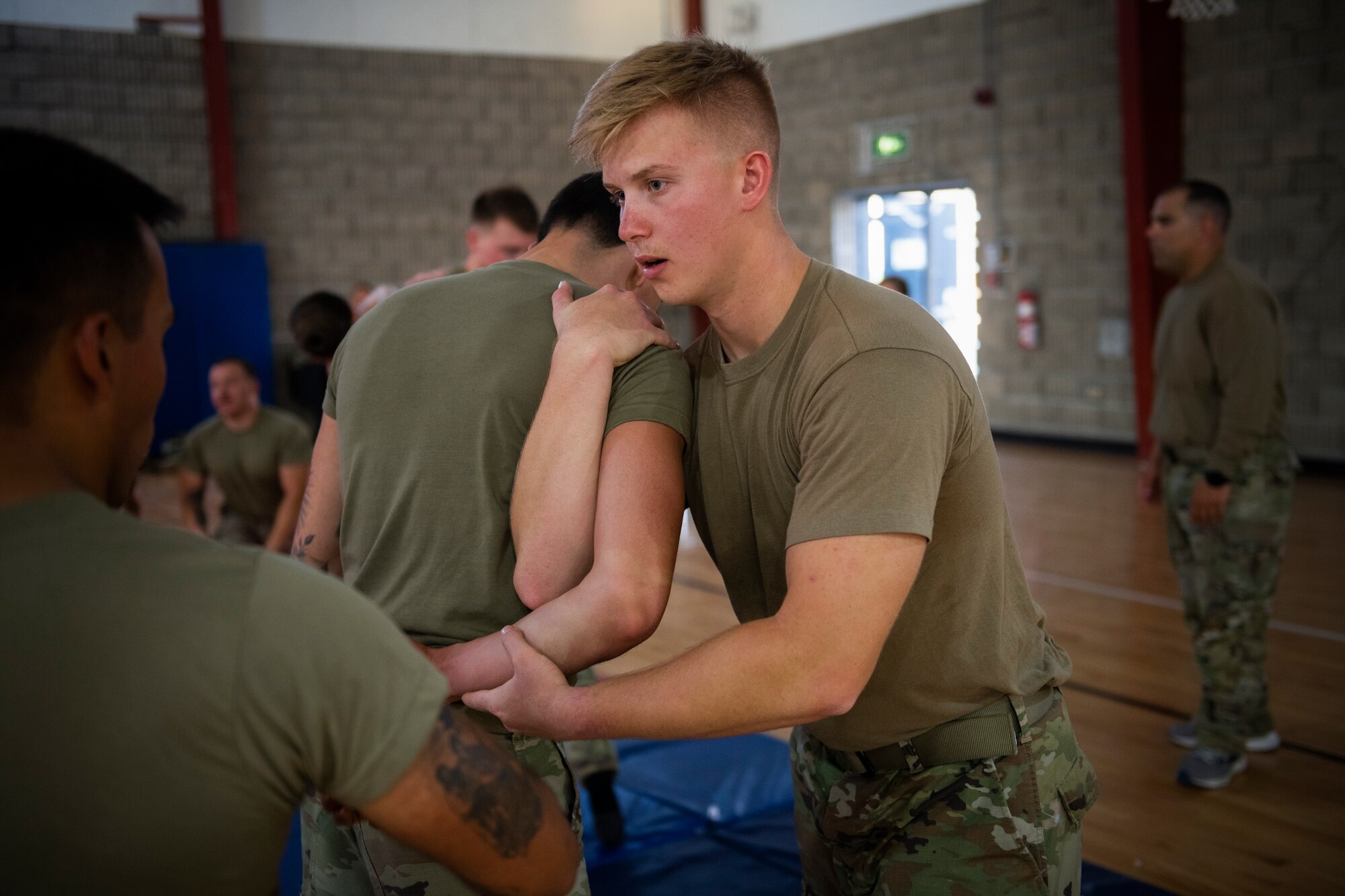 Airmen practice martial arts on each other during training.