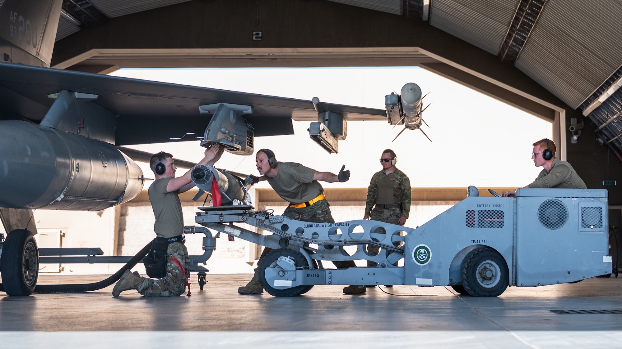 Airmen from the 378th Air Expeditionary Wing conduct an integrated combat turn at King Fahad Air Base, Kingdom of Saudi Arabia, Dec. 7, 2021. U.S. and KSA forces conducted combined operations to better integrate partner capabilities. (U.S. Air Force photo by Senior Airman Jacob B. Wrightsman)