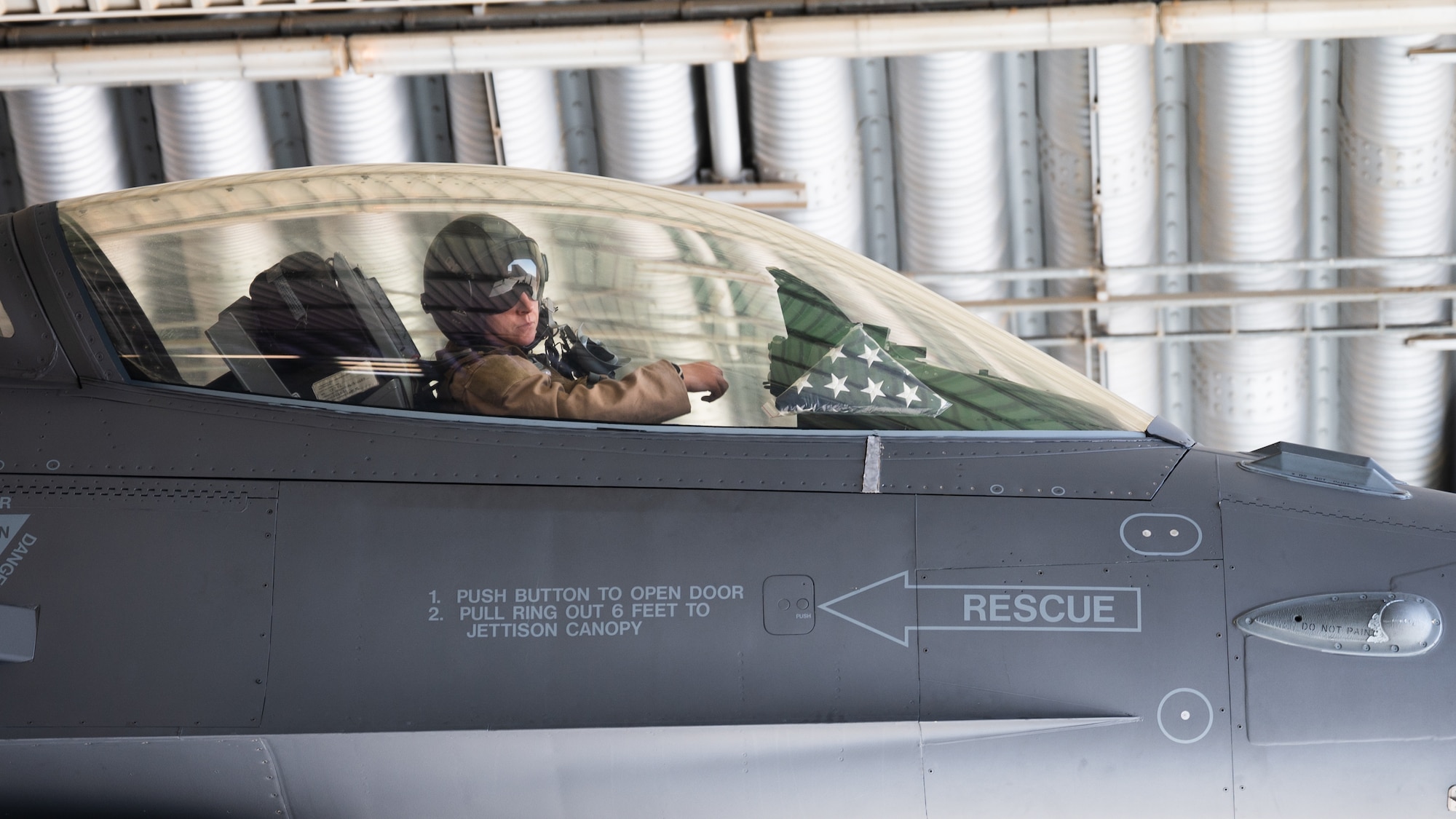 A 176th Expeditionary Fighter Squadron pilot, sits in the cockpit of an F-16 Fighting Falcon while being refueled at King Fahad Air Base, Saudi Arabia, Dec. 7, 2021. U.S. and Saudi forces conducted combined operations, further cultivating strong partnerships in order to deter regional aggressors. (U.S. Air Force photo by Senior Airman Jacob B. Wrightsman)