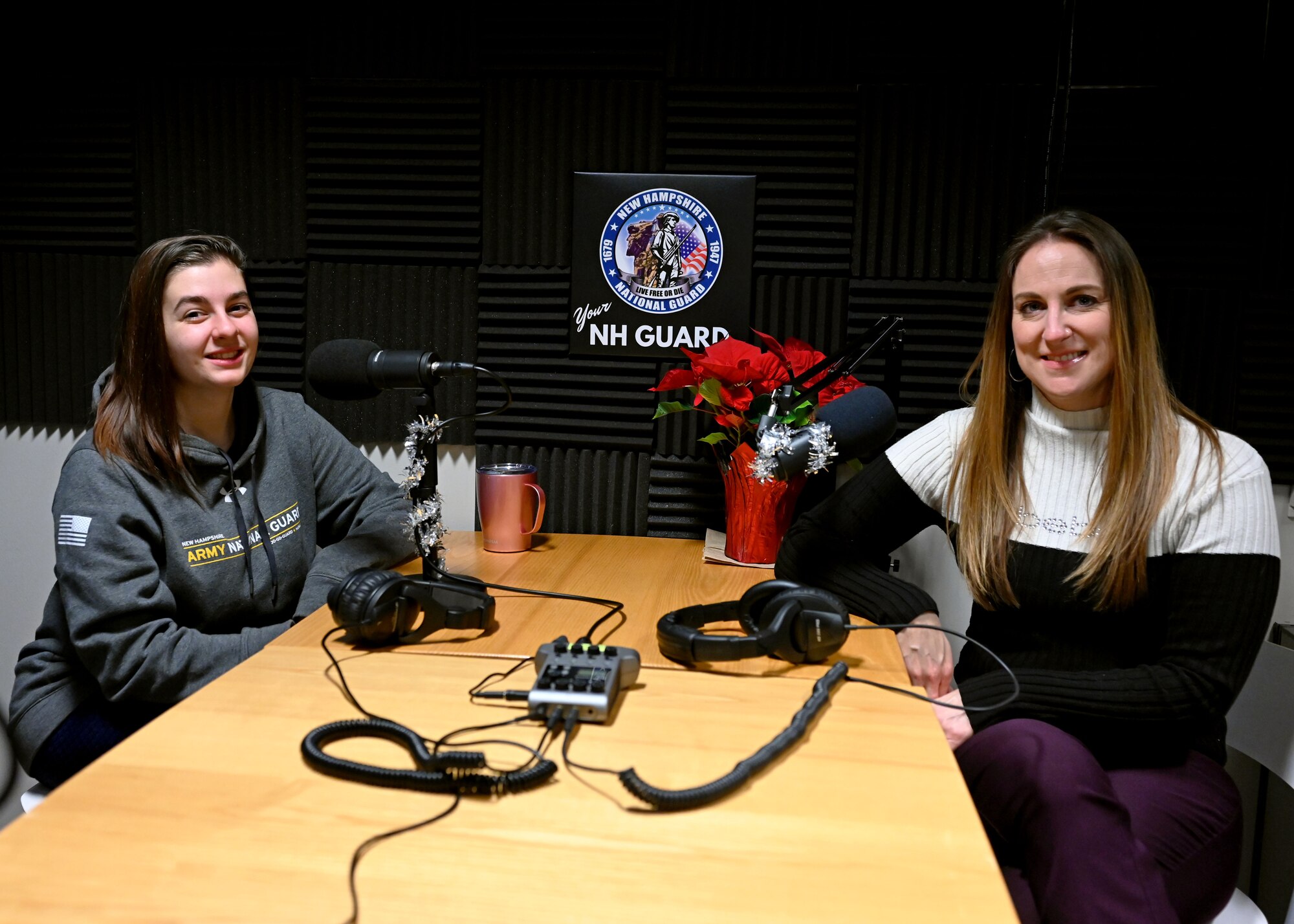 From left, Kiana Delviscovo and Heather Taylor of the NHARNG wellness division pose in the Your NH Guard podcast studio Dec. 14, 2021, in Concord, N.H.