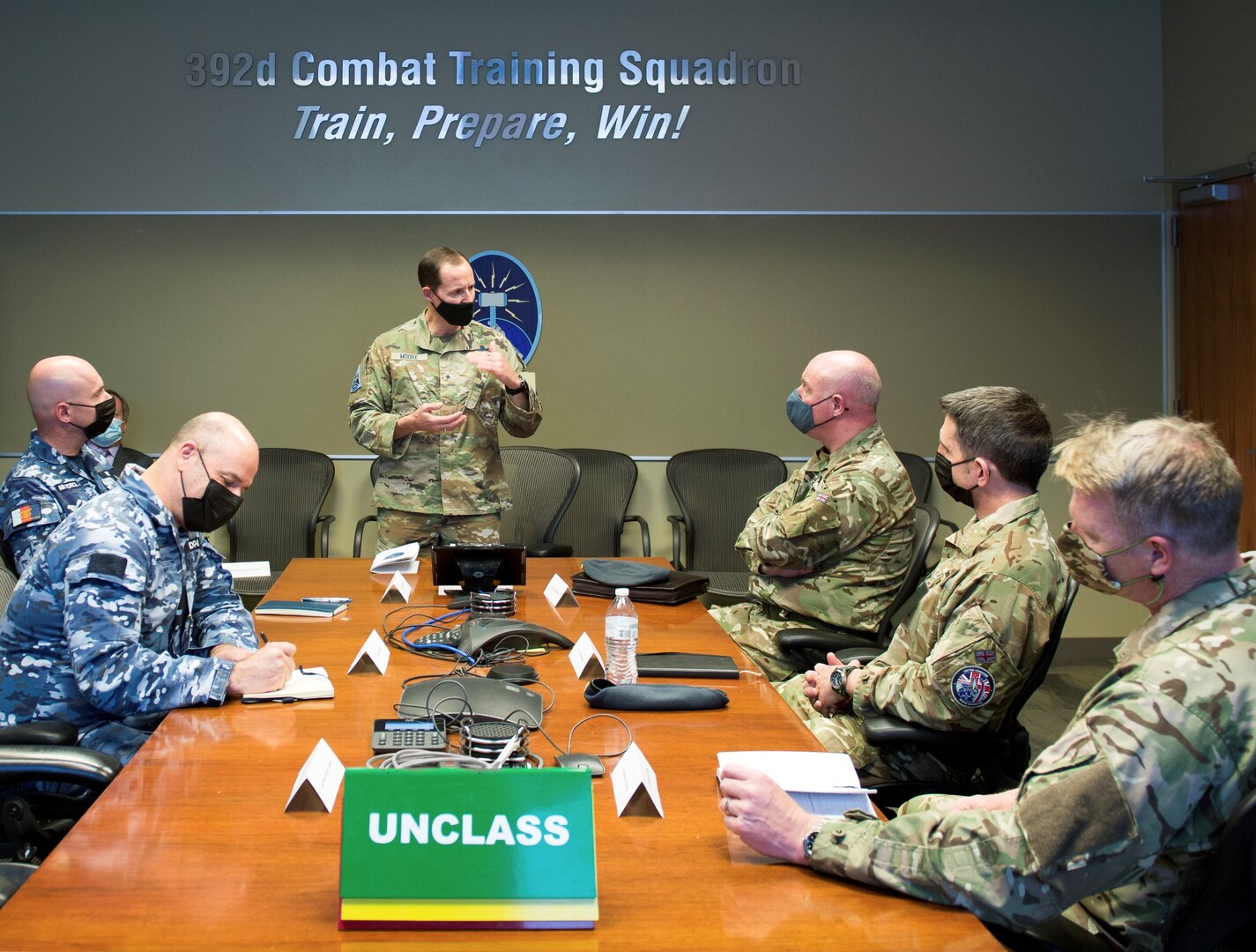 U.S. Space Force Brig Gen Todd Moore, Space Training and Readiness Command Deputy Commander, and distinguished visitors from the United Kingdom, and Australia discuss key topics during SPACE FLAG 22-1 at Schriever Space Force Base, Colorado, Dec. 13, 2021. From left to right: Air Cdre Nicholas Hogan, Director General Space Domain Review, AUS, John Haly, Air and Space Attache,  AUS, Brig Gen Todd Moore, Deputy Commander, STARCOM, Air Vice-Marshall Harvey “Harv” Smyth, Director Space UK, Air Vice-Marshall Paul Godfrey, Commander UK Space Command, Air Cdre JJ “Jez” Attridge, UK. (U.S. Space Force photo by Judi Tomich)