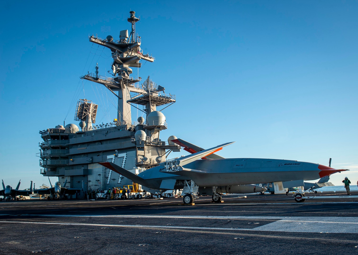 A Boeing unmanned MQ-25 aircraft rests aboard the flight deck aboard the aircraft carrier USS George H.W. Bush (CVN 77).