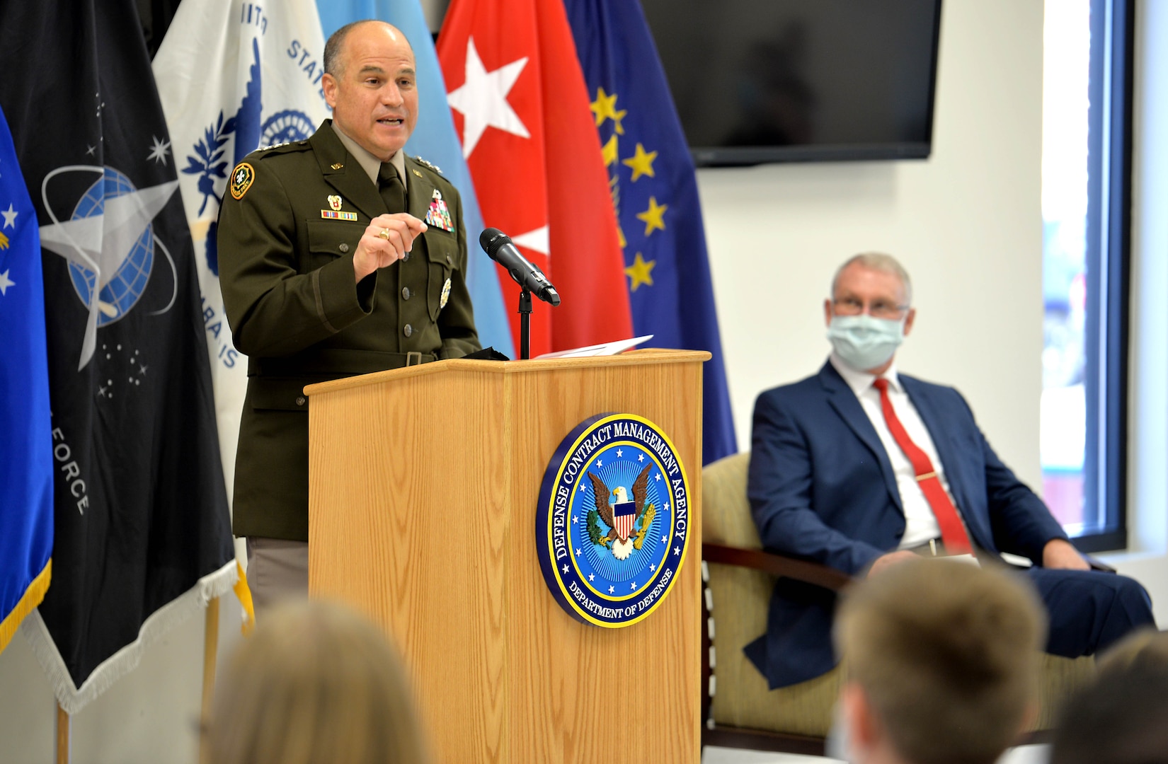 Army Lt. Gen. David Bassett, Defense Contract Management Agency director, speaks to a crowd.