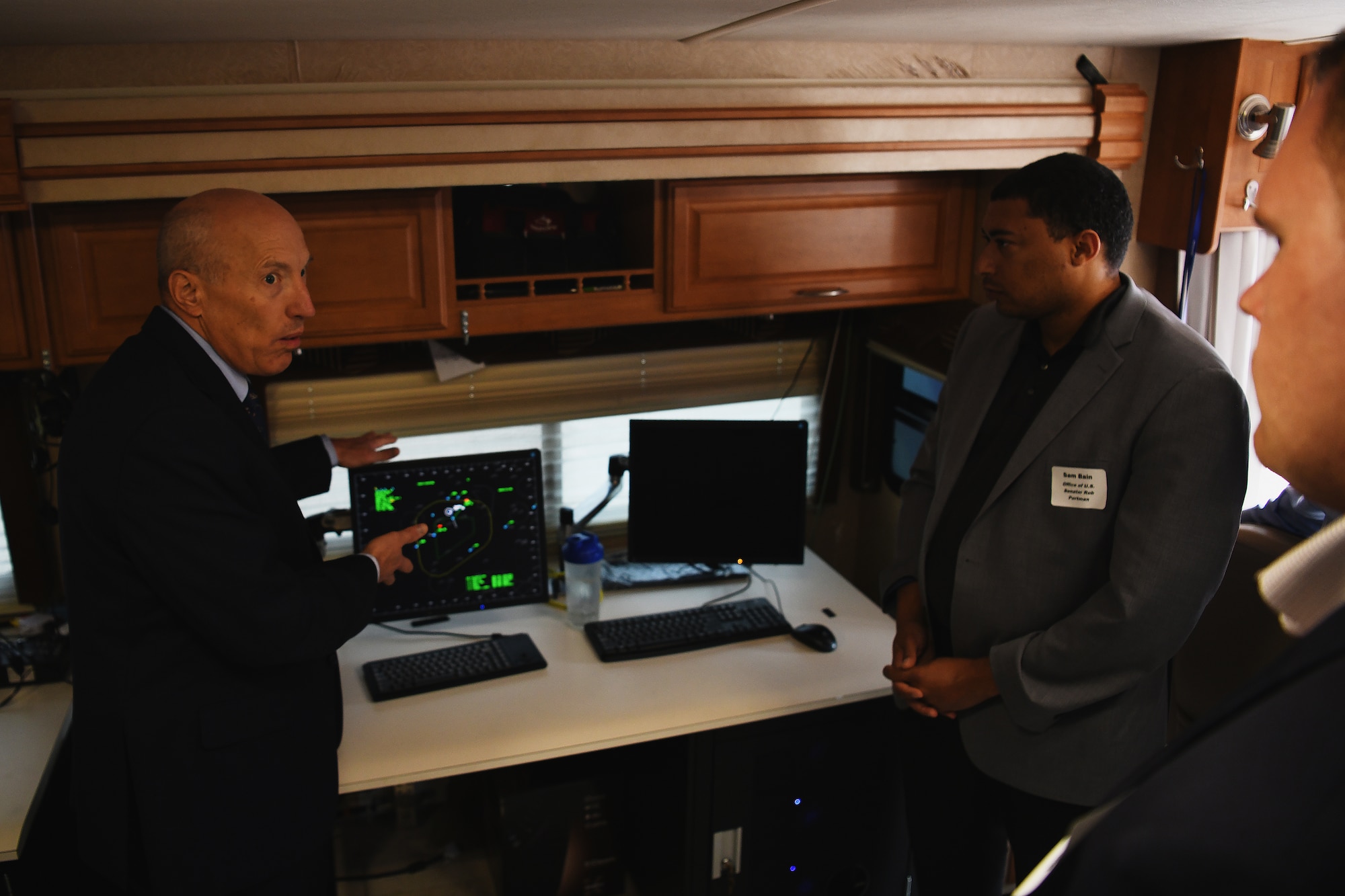 Arthur Huber II, deputy director of airspace and cyber operations at AF material command, explains the capabilities mobile air traffic control suite Sept. 16, 2021 during the 178th Wing's Community Day in Springfield, Ohio. The event enhanced awareness of the missions and capabilites of the wing. (U.S. Air National Guard photo by Shane Hughes)