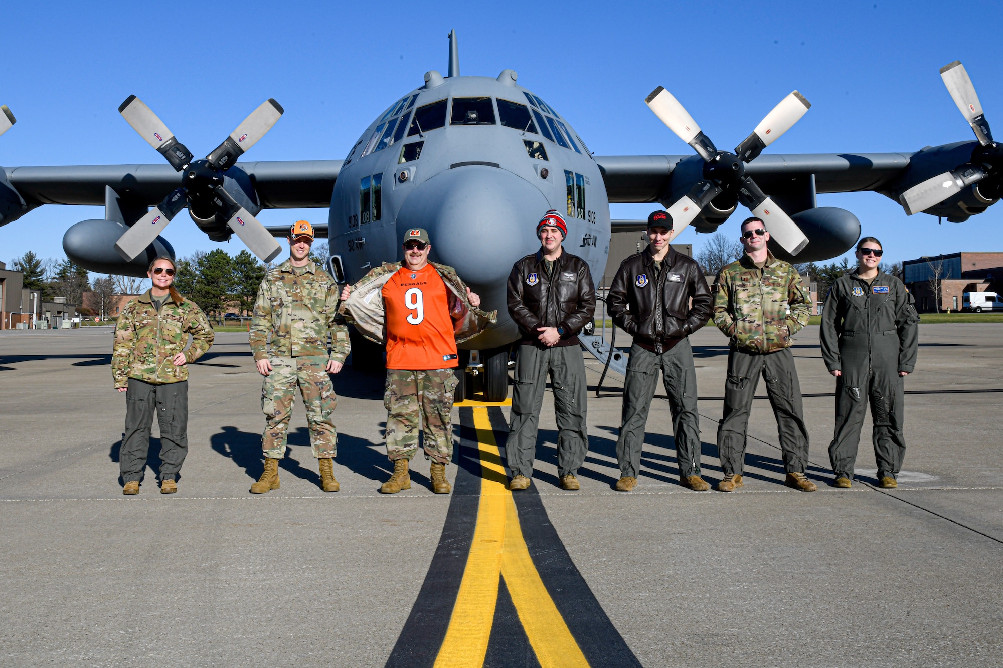 Reserve Citizen Airmen assigned to the 910th Operations Group pose for a photo in front of a C-130H Hercules aircraft on Dec. 17, 2021, at Youngstown Air Reserve Station, Ohio.