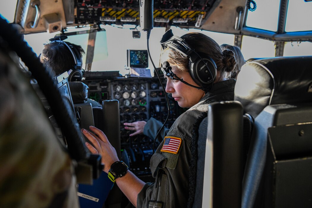 Staff Sgt. Jennifer Feathers a flight engineer, assigned to the 910th Operations Group prepares for take-off in a C-130H Hercules aircraft on Dec. 17, 2021, at Youngstown Air Reserve Station, Ohio.