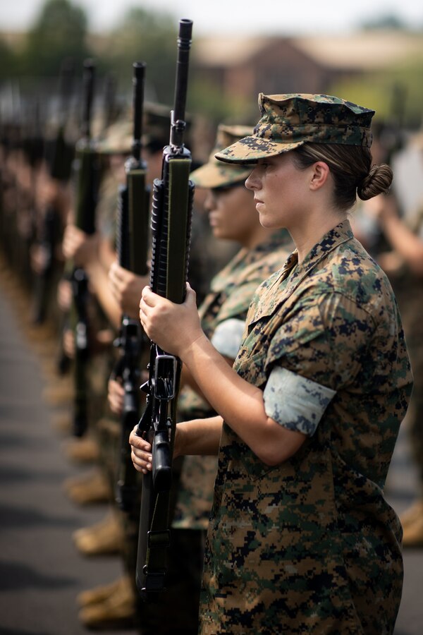U.S. Marine Corps officer candidates with Lima Company participate in a close order drill competition at Officer Candidates School on Marine Corps Base Quantico, Virginia, Aug. 9, 2021. Close order drill instills discipline by increasing precision, response to orders and confidence within the candidates. (U.S. Marine Corps photo by Tia Dufour)