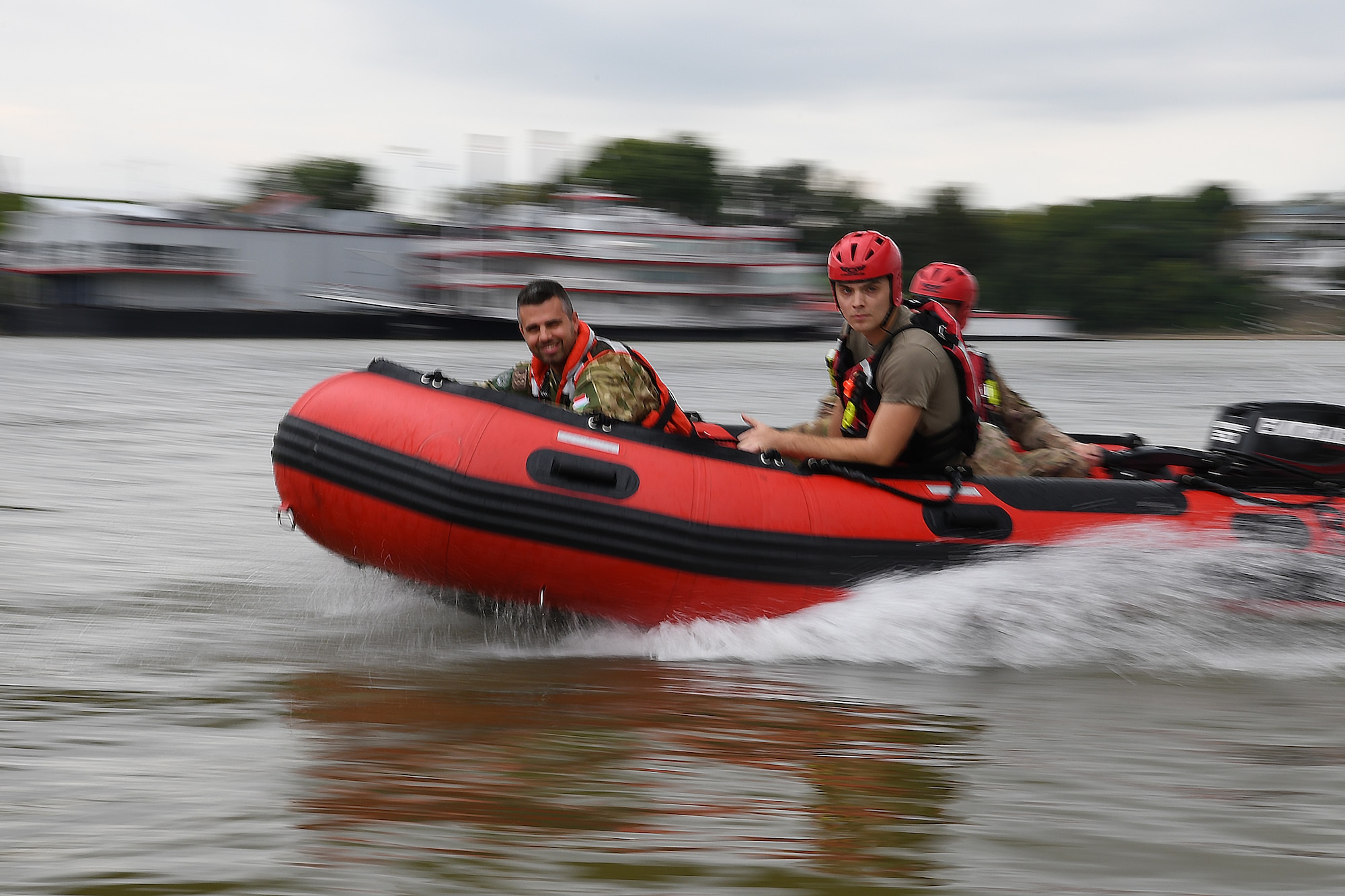 Airmen assigned to the Ohio National Guard's 178th Wing demonstrate their water rescue skills and capabilities Sept. 15, 2021 for a Hungarian Defense Forces delegation on the Ohio River in Cincinnati.  The State Partnership Program between the Ohio National Guard and Hungary enhances joint training, builds cultural understanding and showcases the accomplishments of collaborating to achieve security cooperation goals.(U.S. Air National Guard photo by Shane Hughes)