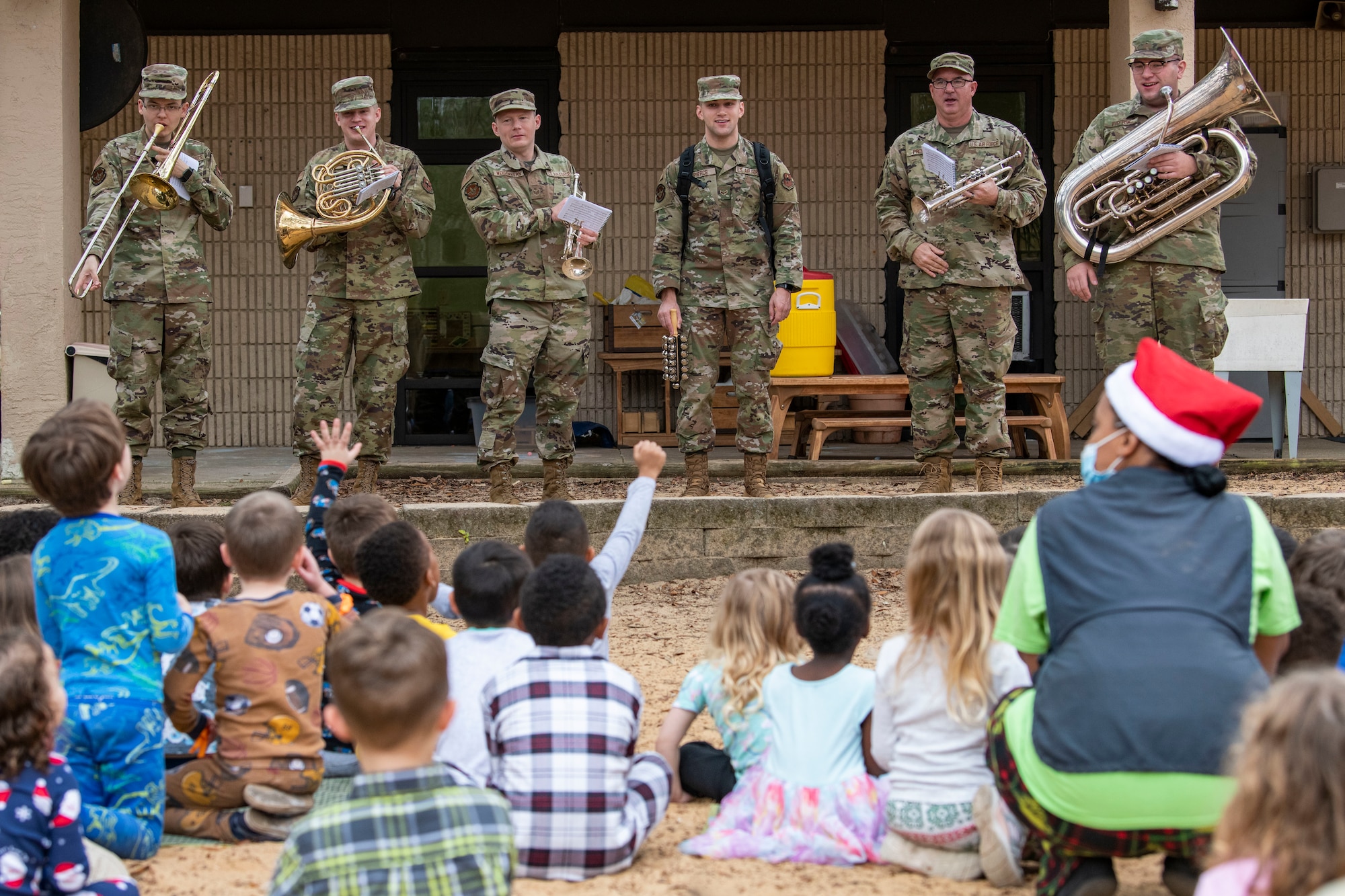 The U.S. Air Force Band of the West performs at the child development center during a caroling tour