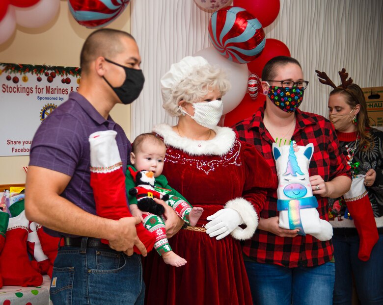 The holiday icon came bearing approximately 500 stockings full of gifts for junior Marines, which were intended to build comradery and boost morale during the holiday season.