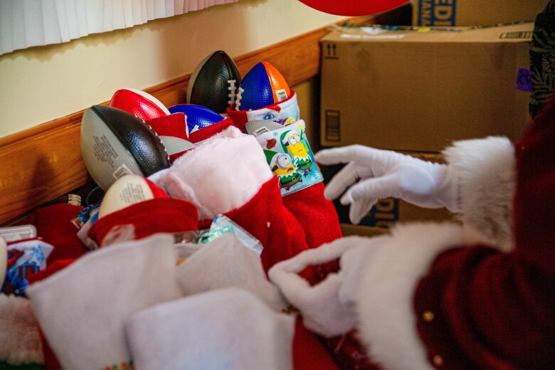 The holiday icon came bearing approximately 500 stockings full of gifts for junior Marines, which were intended to build comradery and boost morale during the holiday season.