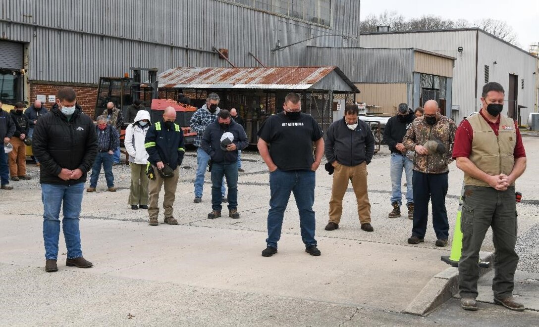 Members of the Arnold Engineering Development Complex workforce bow their heads as a prayer is said during a memorial held in remembrance of John Hill and Alvin Overman who died 50 years ago working at Arnold Air Force Base, Tenn., Dec. 9, 2021. The two men were working in an offline furnace and became asphyxiated by argon that had settled in their location. They did not have the O2 meters that have since become available to warn them of dangerous air conditions. (U.S. Air Force photo by Jill Pickett)