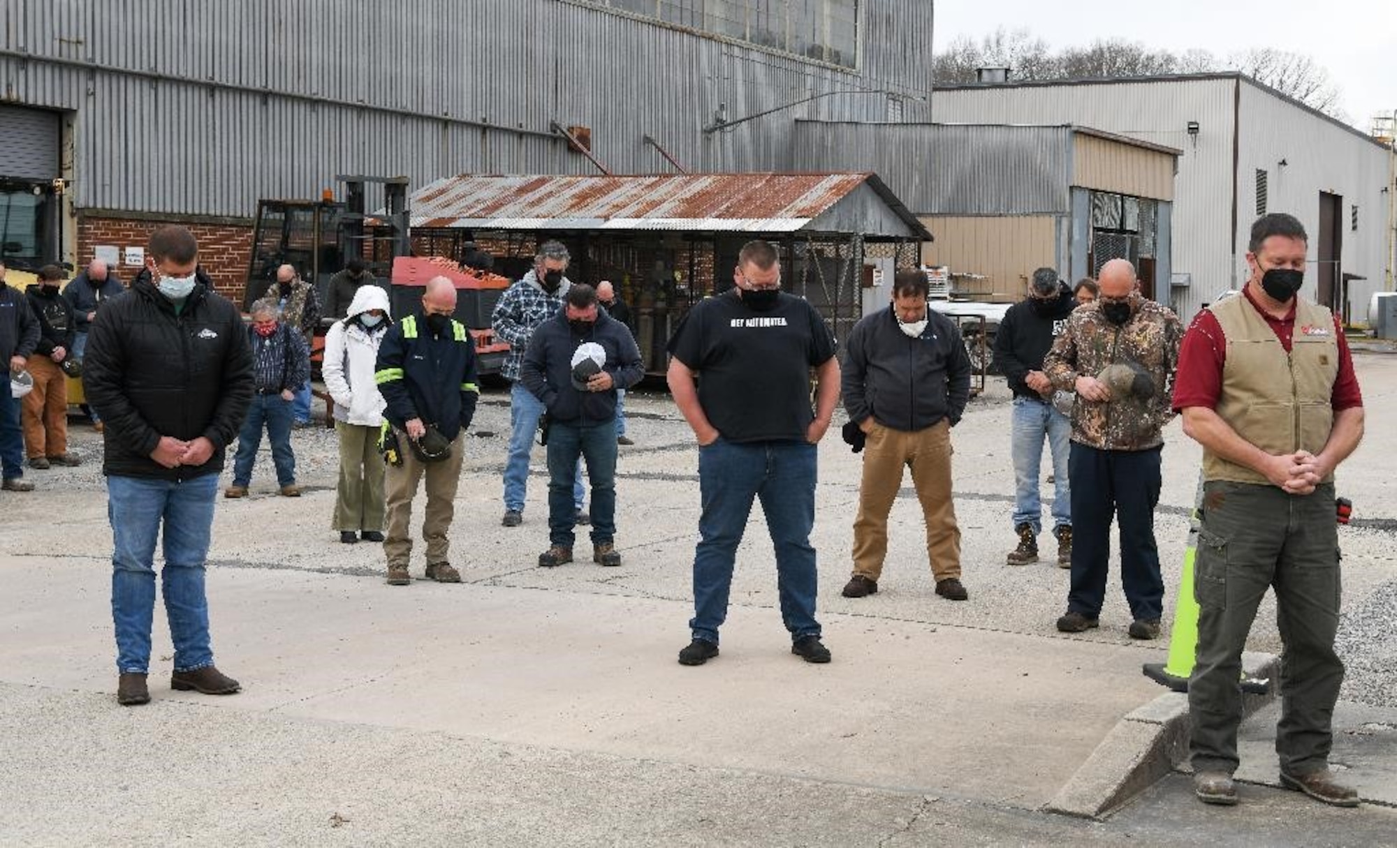Members of the Arnold Engineering Development Complex workforce bow their heads as a prayer is said during a memorial held in remembrance of John Hill and Alvin Overman who died 50 years ago working at Arnold Air Force Base, Tenn., Dec. 9, 2021. The two men were working in an offline furnace and became asphyxiated by argon that had settled in their location. They did not have the O2 meters that have since become available to warn them of dangerous air conditions. (U.S. Air Force photo by Jill Pickett)