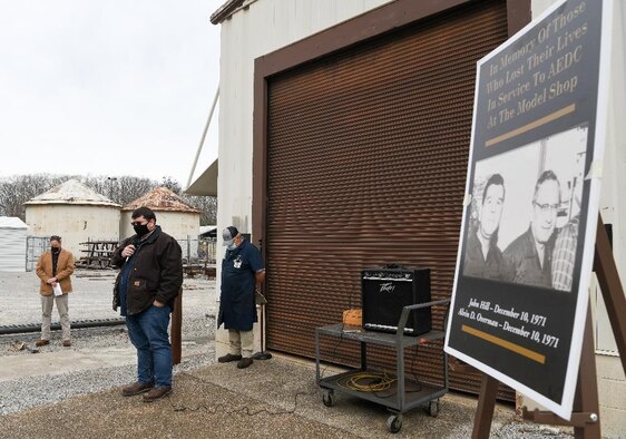 Matt Logan, center, crane and rigging planner/scheduler at Arnold Air Force Base, Tenn., says a prayer during a memorial held in remembrance of John Hill and Alvin Overman who died 50 years ago working at Arnold Air Force Base, Tenn., Dec. 9, 2021. Hill and Overman died as a result of argon asphyxiation while working on an offline furnace. Tools regularly used today to mitigate risk were not available at the time. From left, also pictured are Warner Holt, Test Operations and Sustainment contractor group manager for Manufacturing, and Jim Hereford, chairman for the Model Shop Safety Leadership Committee. (U.S. Air Force photo by Jill Pickett)