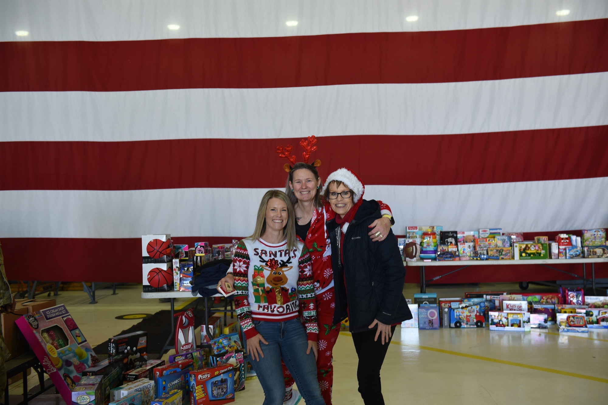 ladies in front of flag