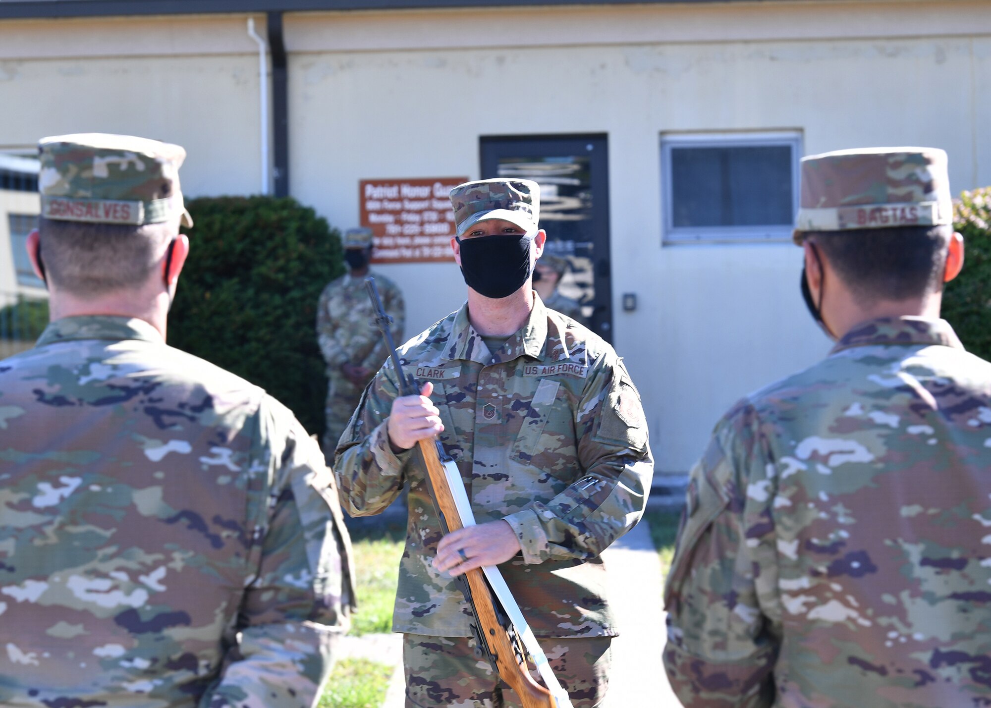 image of Airman speaking to other Airmen