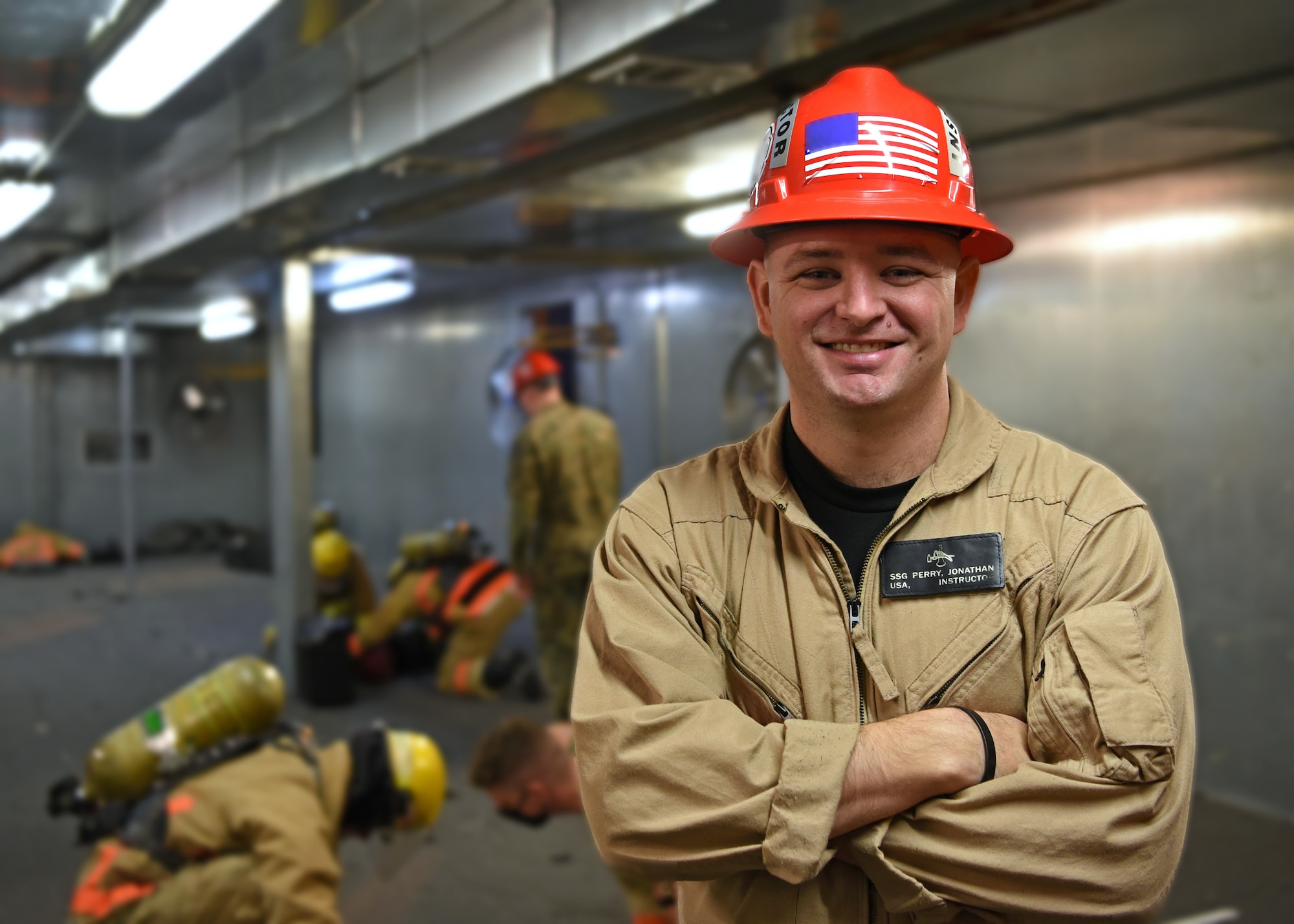 U.S. Army Staff Sgt. Jonathan Perry, 169th Engineer Battalion fire protection instructor, teaches students victim removal techniques on Goodfellow Air Force Base, Texas, Nov. 2, 2021. Perry instructed the fire protection fundamentals block at the Louis F. Garland Department of Defense Fire Academy. (U.S. Air Force photo by Senior Airman Abbey Rieves)