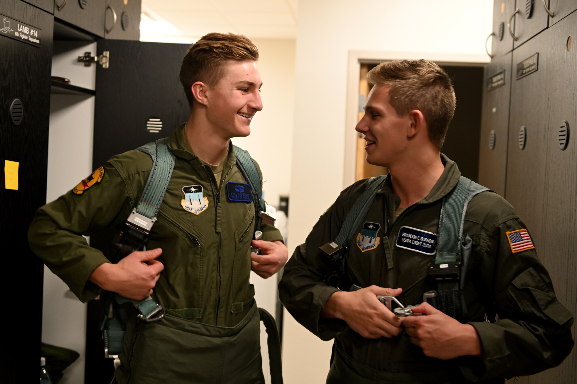 (From left to right) Luke Anderson and Brandon Burrow, U.S. Air Force Academy cadets, prepare for an F-16 Viper familiarization flight, Dec. 14, 2021, on Holloman Air Force Base, New Mexico. With the widespread shortage of pilots in the U.S. Air Force, this familiarization flight served as a recruitment tool for potential aviators. (U.S. Air Force photo by Staff Sgt. Christopher S. Sparks)
