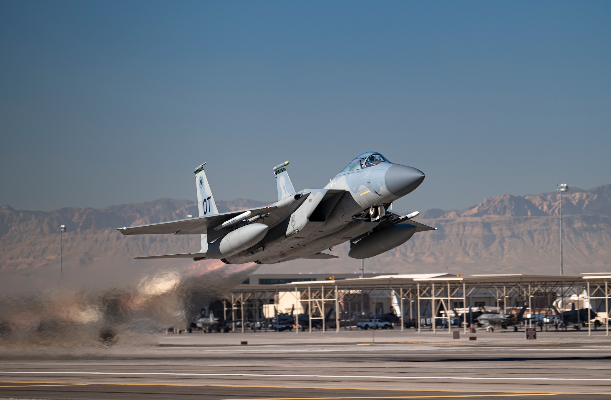 An F-15C Eagle takes off to conduct its final defensive counter air vul during Weapons School Integration 21-B at Nellis Air Force Base, Nev., Dec. 8, 2021. As the Air Force continues to modernize, this class marks the final F-15C Weapons Instructor Course to be taught at the United States Air Force Weapons School.
