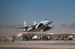 An F-15C Eagle takes off to conduct its final defensive counter air vul during Weapons School Integration 21-B at Nellis Air Force Base, Nev., Dec. 8, 2021. As the Air Force continues to modernize, this class marks the final F-15C Weapons Instructor Course to be taught at the United States Air Force Weapons School.