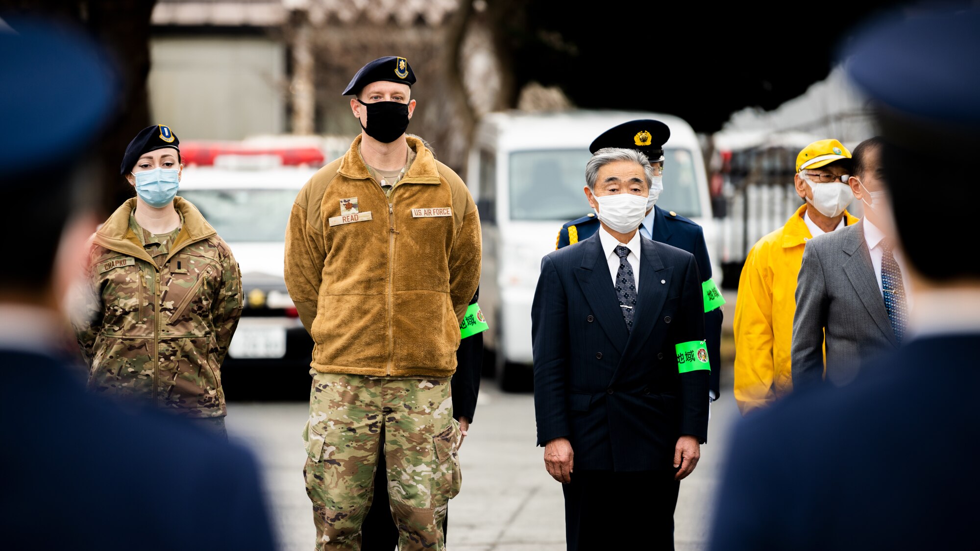 Service members, community members, and Misawa City police officers come together during the End-of-Year Traffic Safety and Crime Prevention Campaign in Misawa City, Japan, Dec. 16, 2021. During the campaign, 35th Fighter Wing, Misawa City and police leadership distributed flyers with information on what to do if anyone in the community finds themselves in an unsafe environment. (U.S. Air Force photo by Staff Sgt. Jao’Torey Johnson)