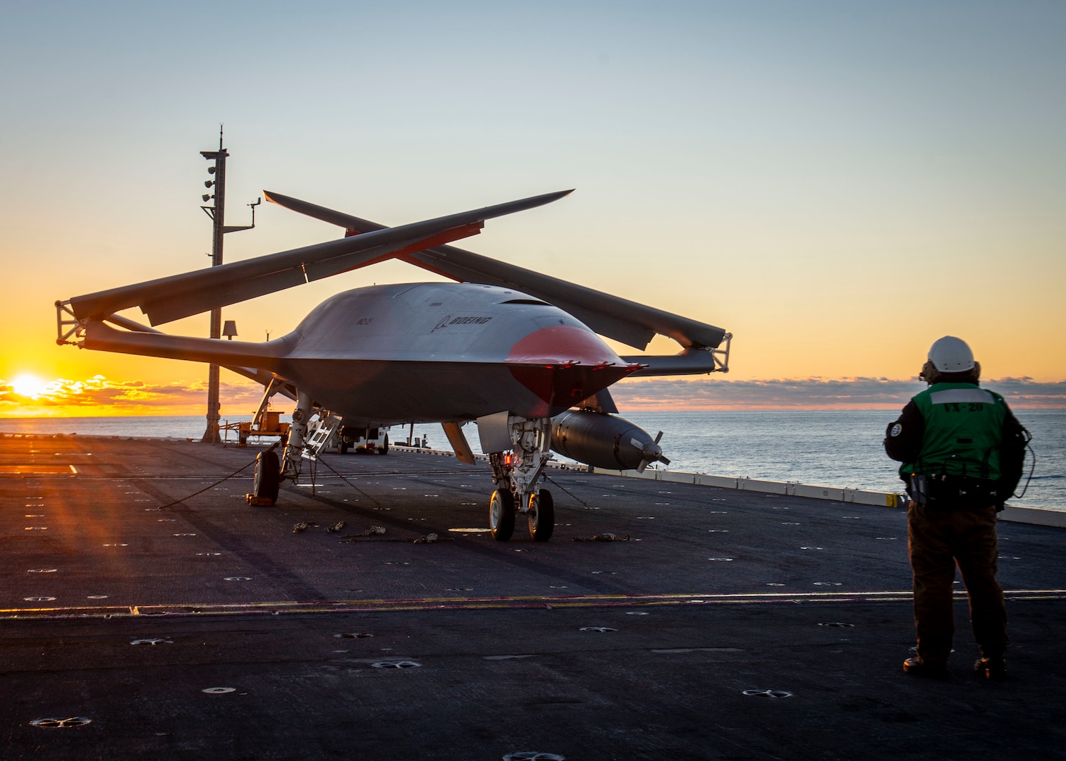 A Boeing unmanned MQ-25 aircraft is towed on the flight deck aboard the aircraft carrier USS George H.W. Bush (CVN 77).